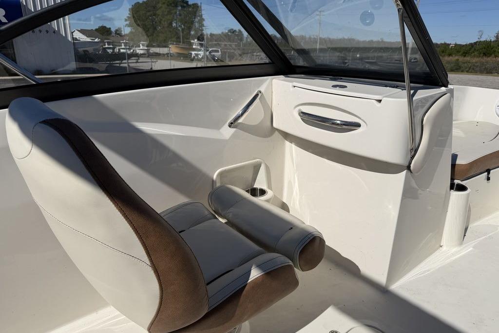 2024 Stingray 191 DC boat interior with white and brown seating, modern design.