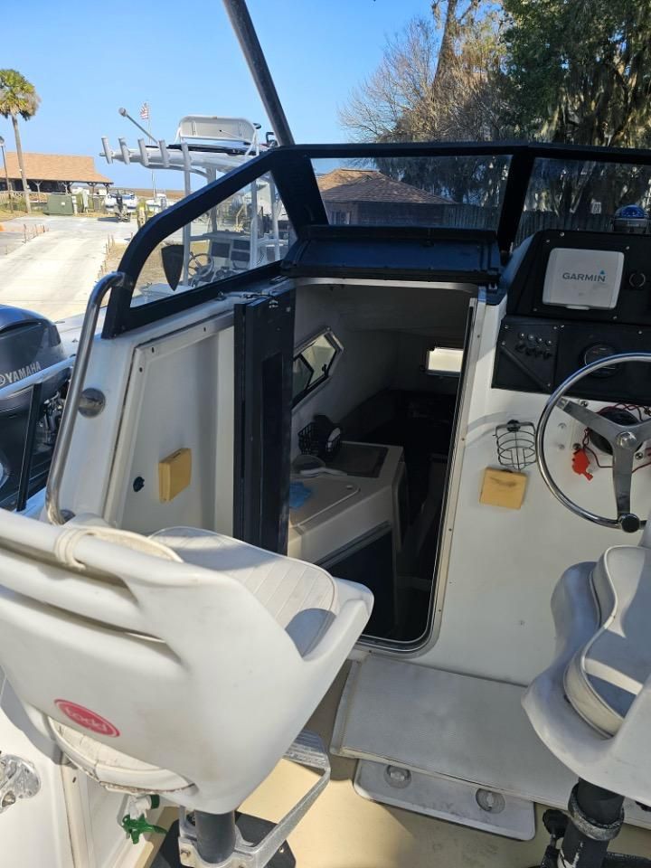 1991 Pro-Line Cuddy Cabin boat with open cabin and helm area.