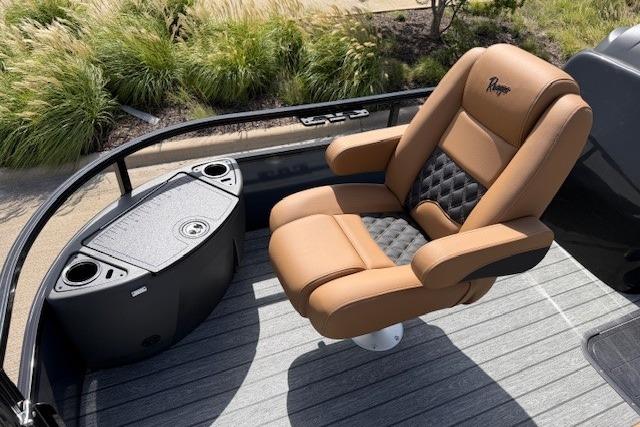 Luxurious seating on 2026 Ranger 223F boat with cup holders and sleek design.