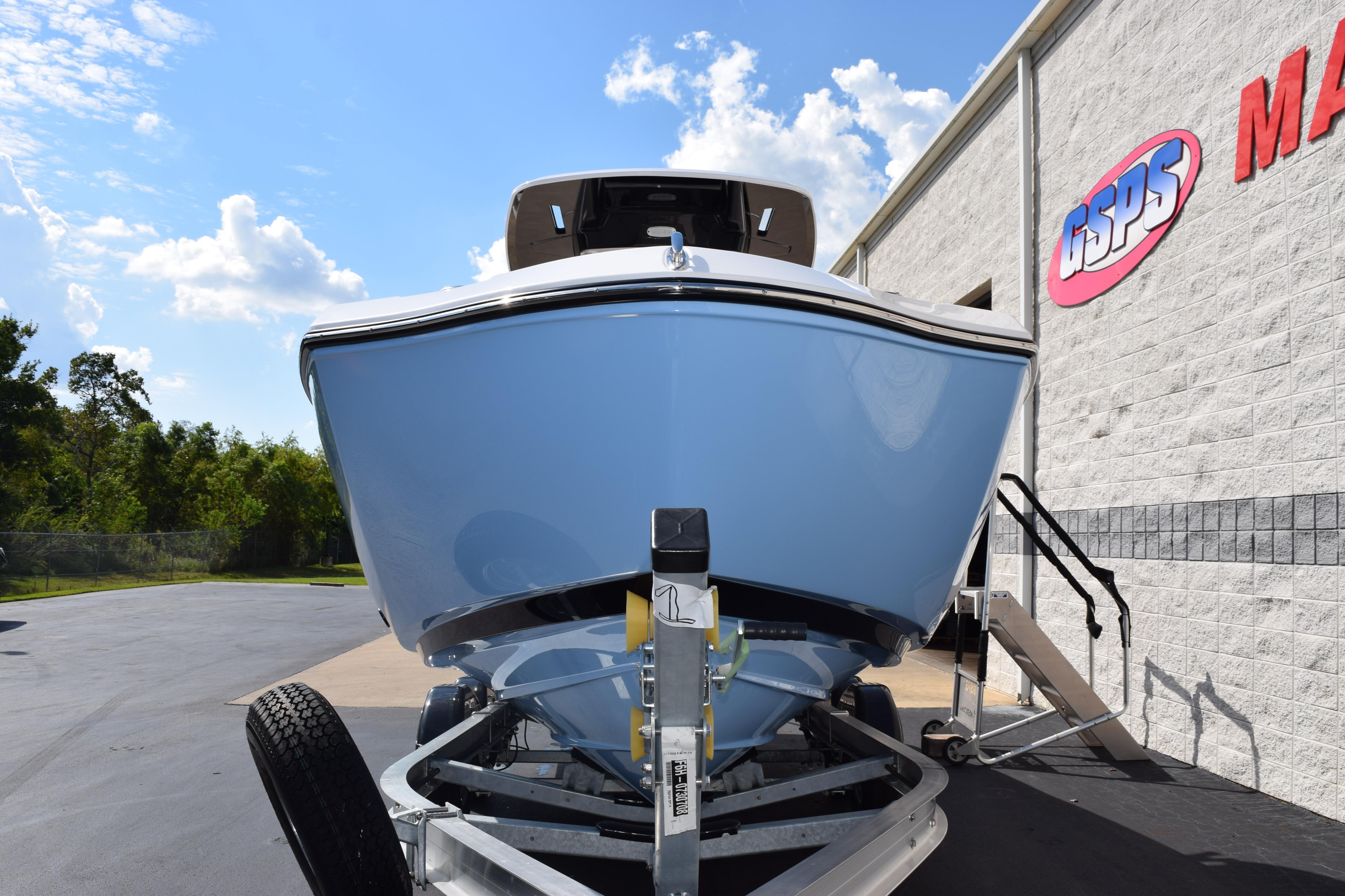 2026 Yamaha Boats 255 FSH Sport H on trailer, parked outside dealership.