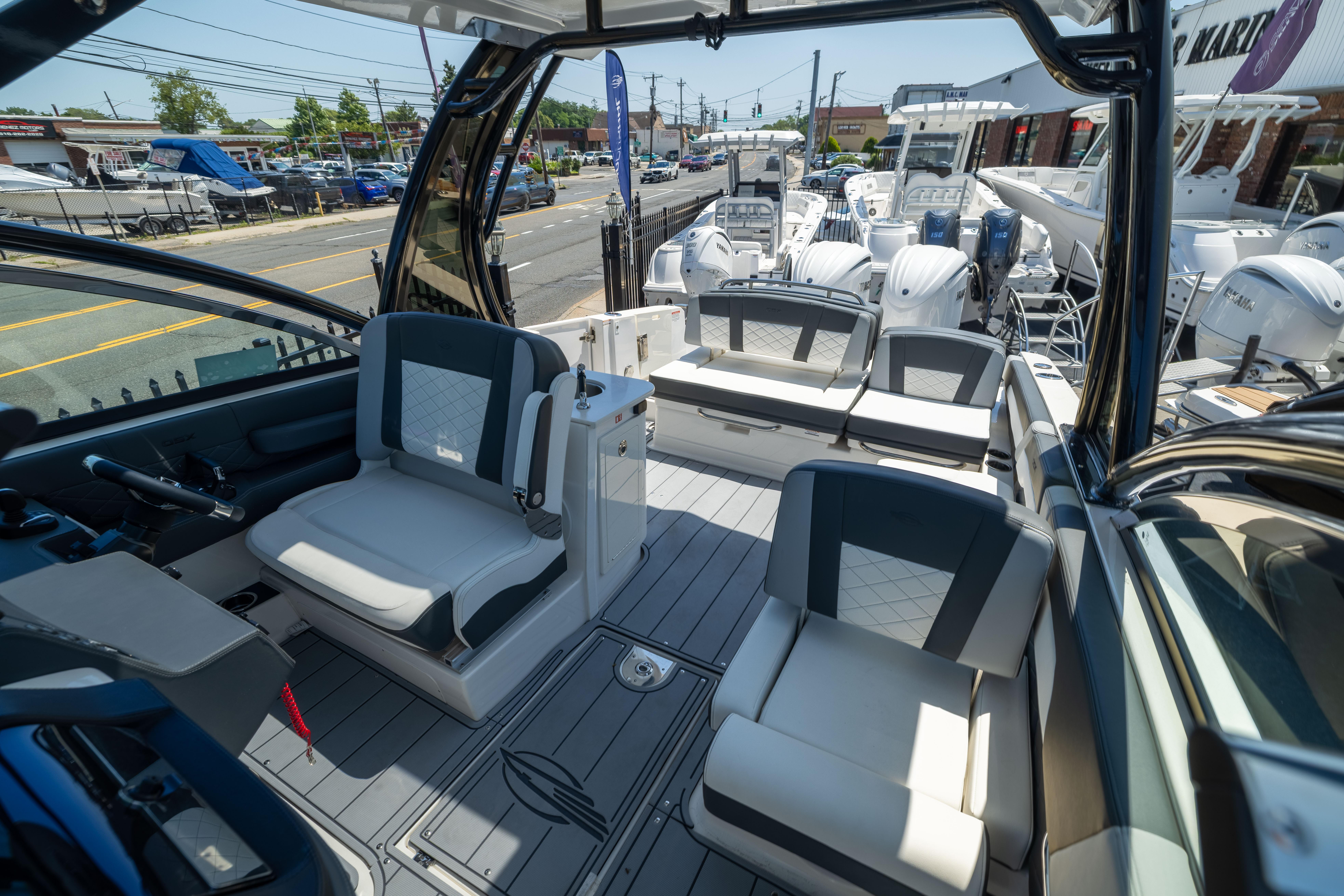 2026 Chaparral 310 OSX boat interior with modern seating and sleek design.