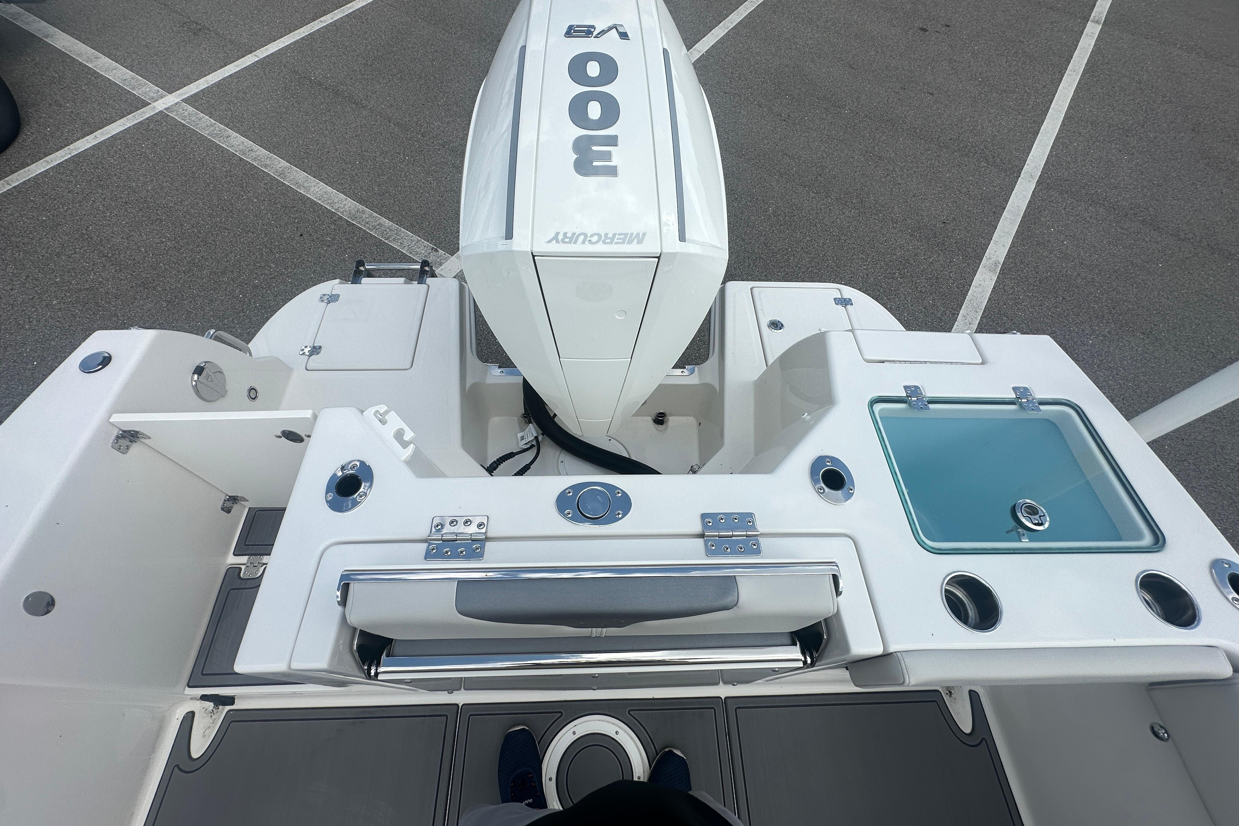 2026 Sailfish 226 DC boat with Mercury 300 engine, featuring a sleek deck layout.