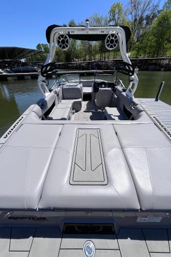 2024 Moomba Max boat with sleek design, docked on a sunny day.