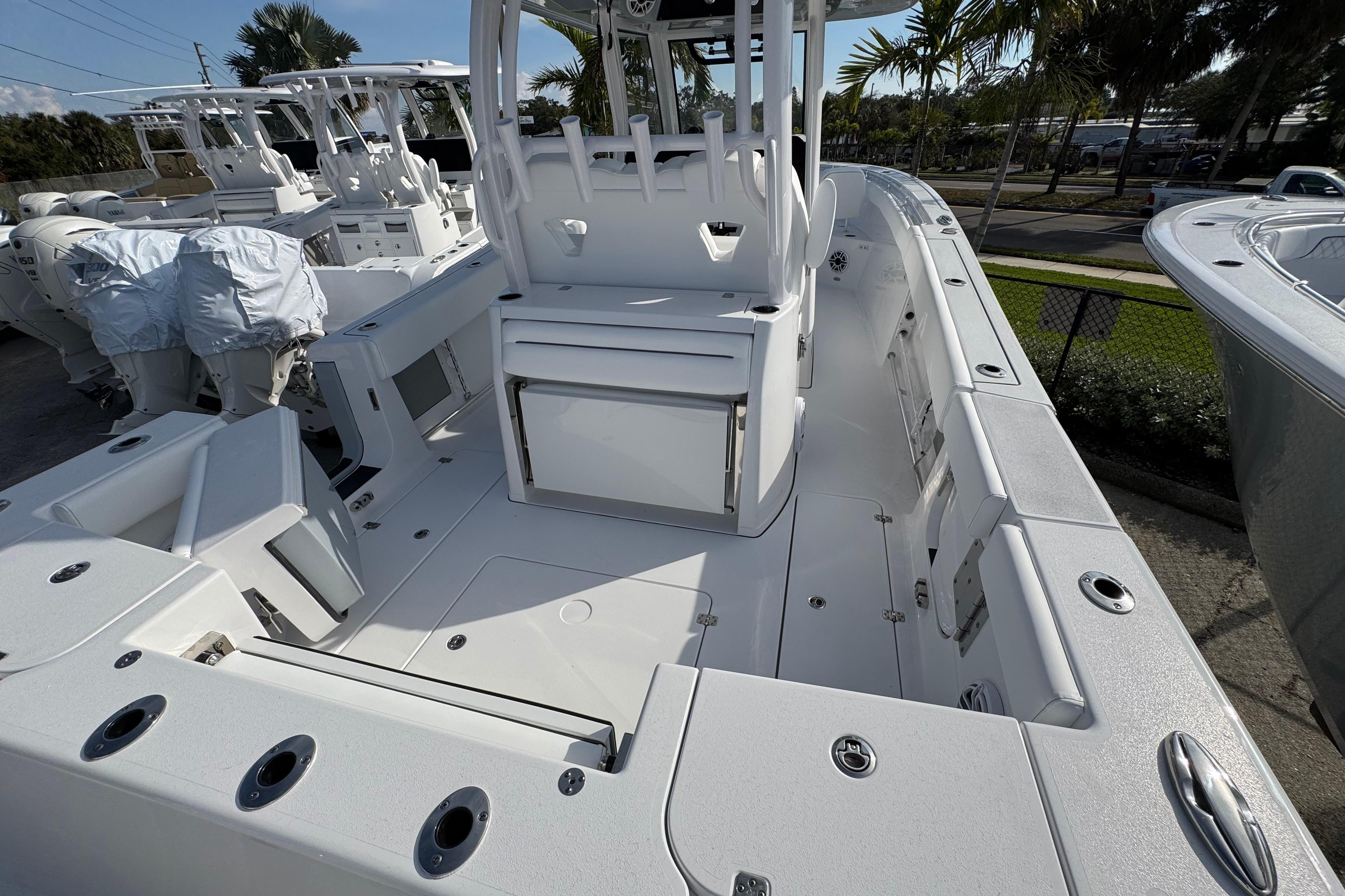 2026 Sportsman Open 302 Center Console boat, spacious deck, modern design, docked outdoors.
