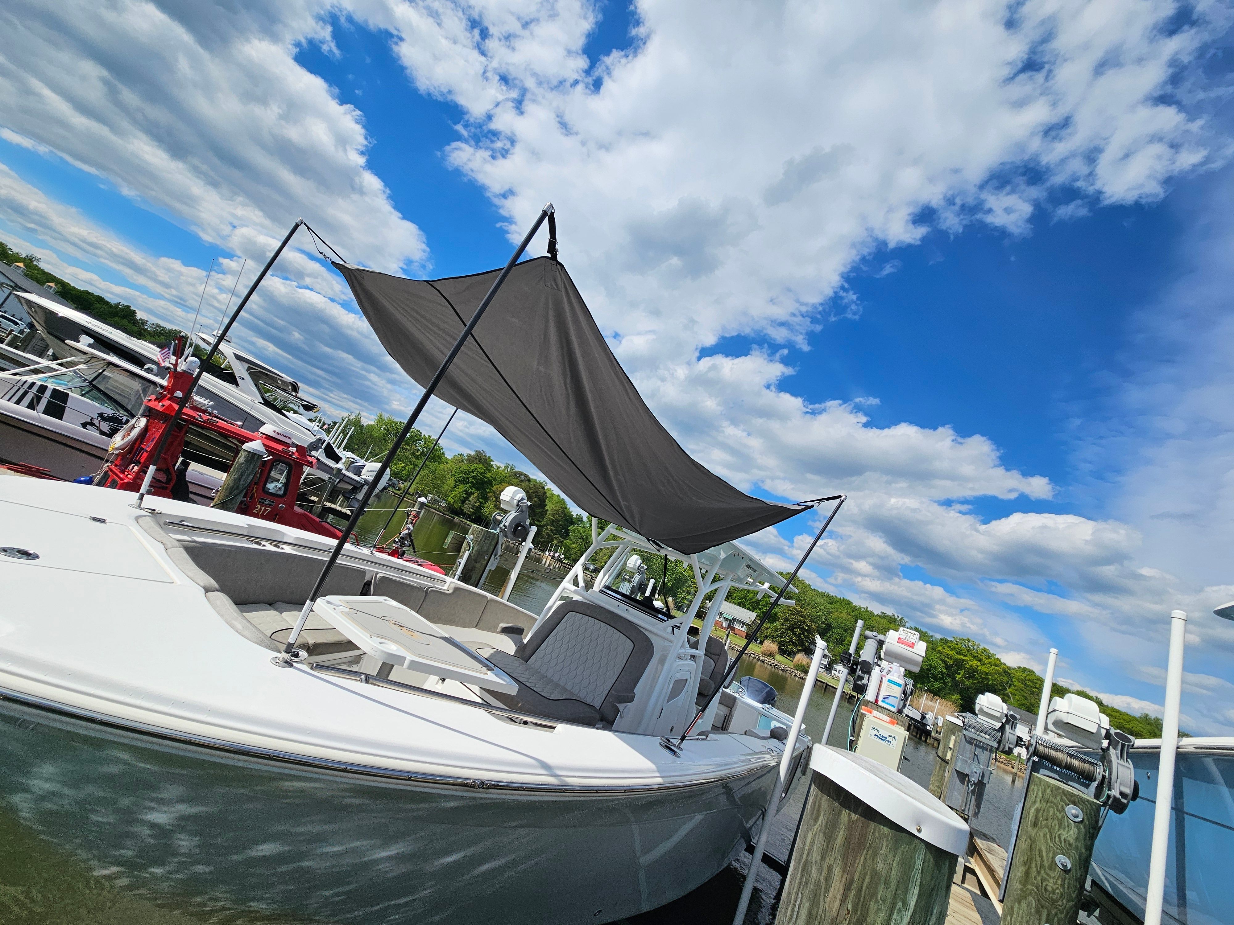 2021 Sea Fox 288 Commander boat docked under blue sky.