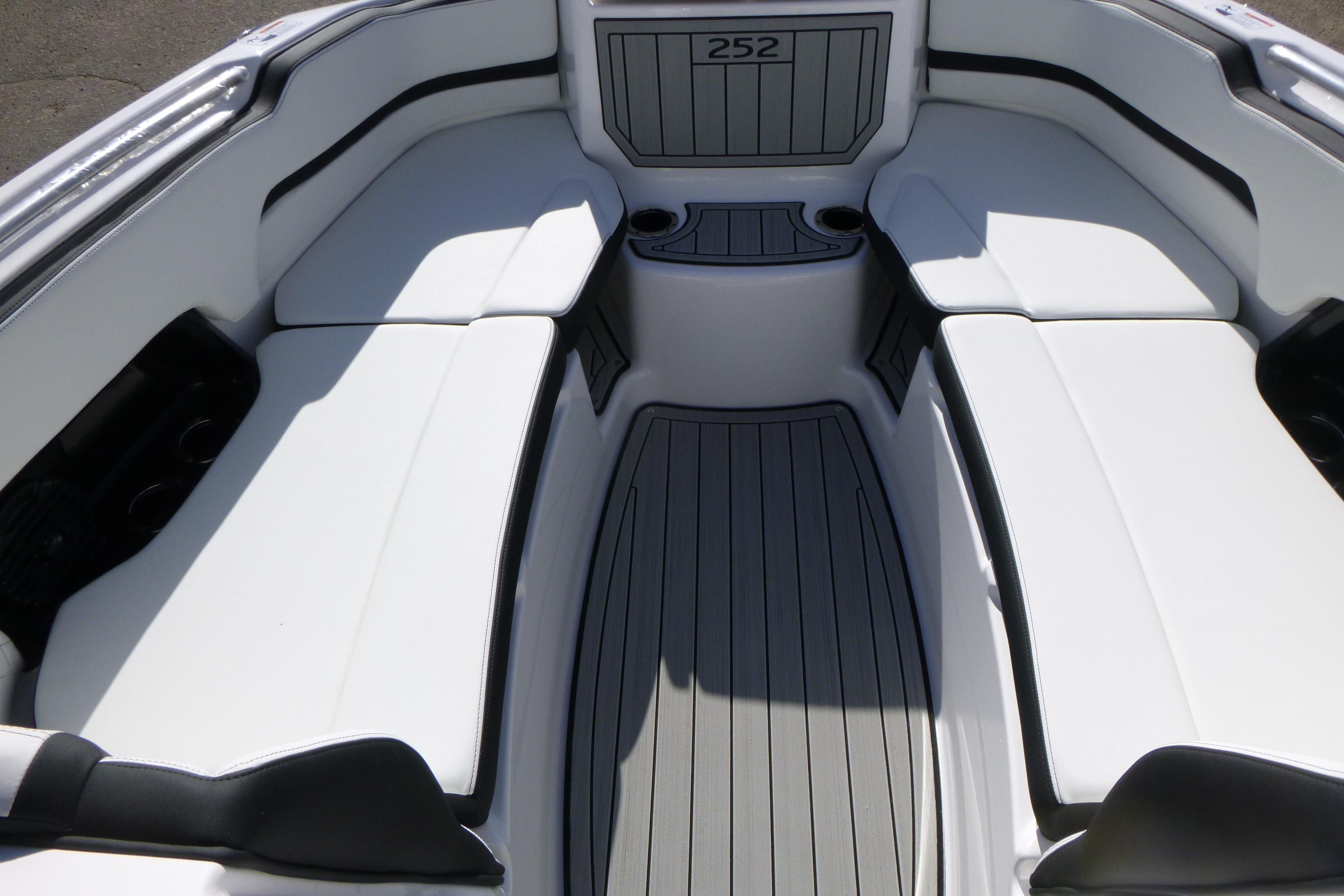 Luxurious interior of 2026 Yamaha Boats 252SD with sleek white seating and modern design.