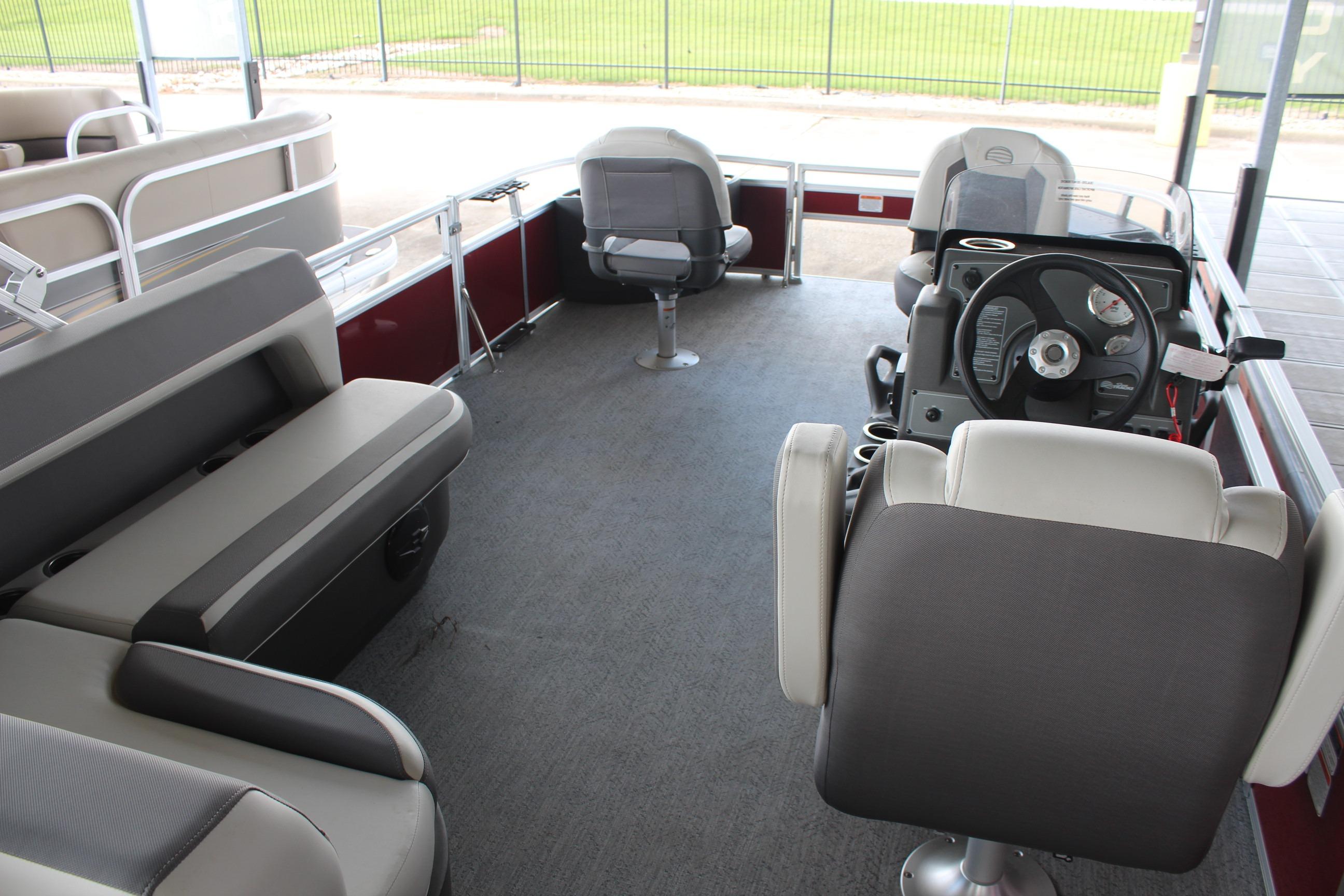 2026 Sun Tracker Bass Buggy 18 DLX interior with seating and steering console.