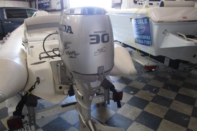 2000 Zodiac Yachtline 340DL with Honda 30 outboard motor in showroom.