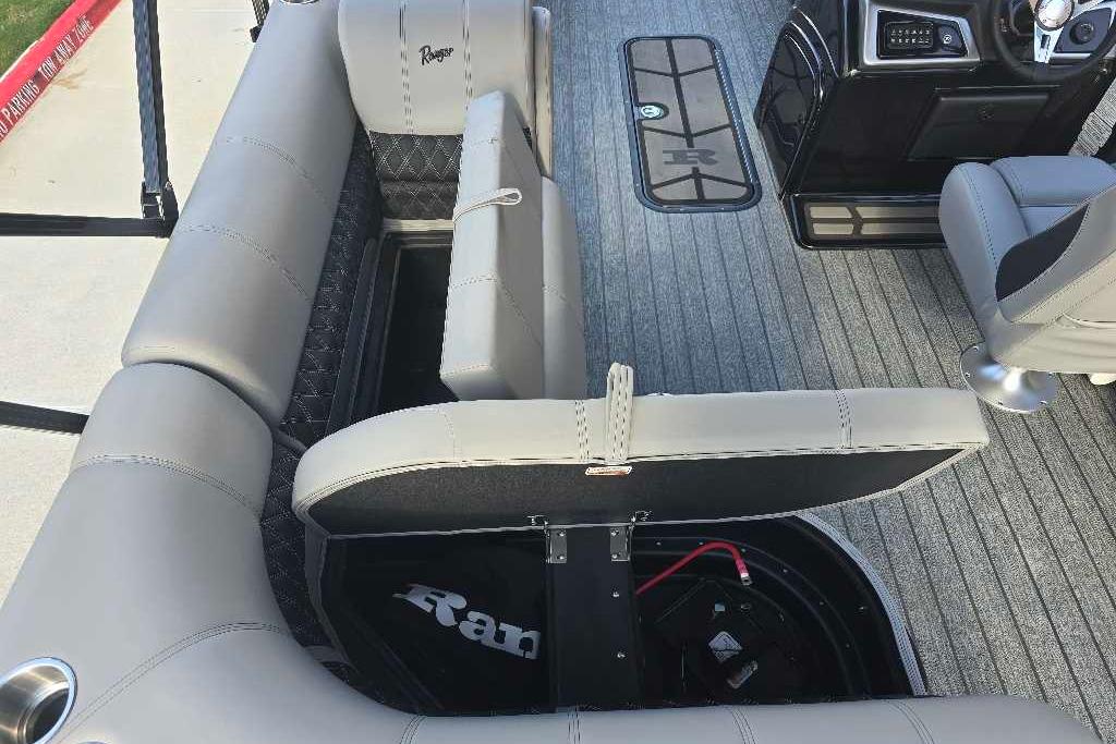 2026 Ranger 223FC boat interior with gray seating and storage compartments.