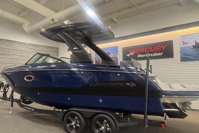2026 Chaparral 6 SSX boat displayed indoors, featuring sleek design and modern features.