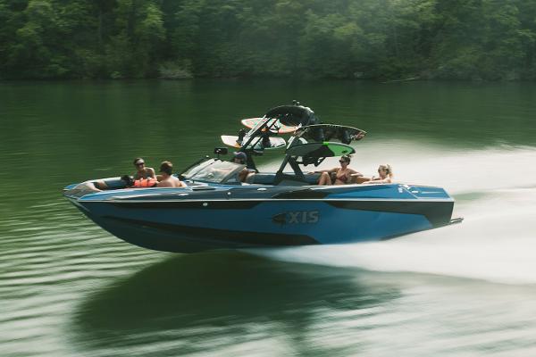 Manufacturer Provided Image: 2021 Axis A24 boat speeding on a lake with passengers.