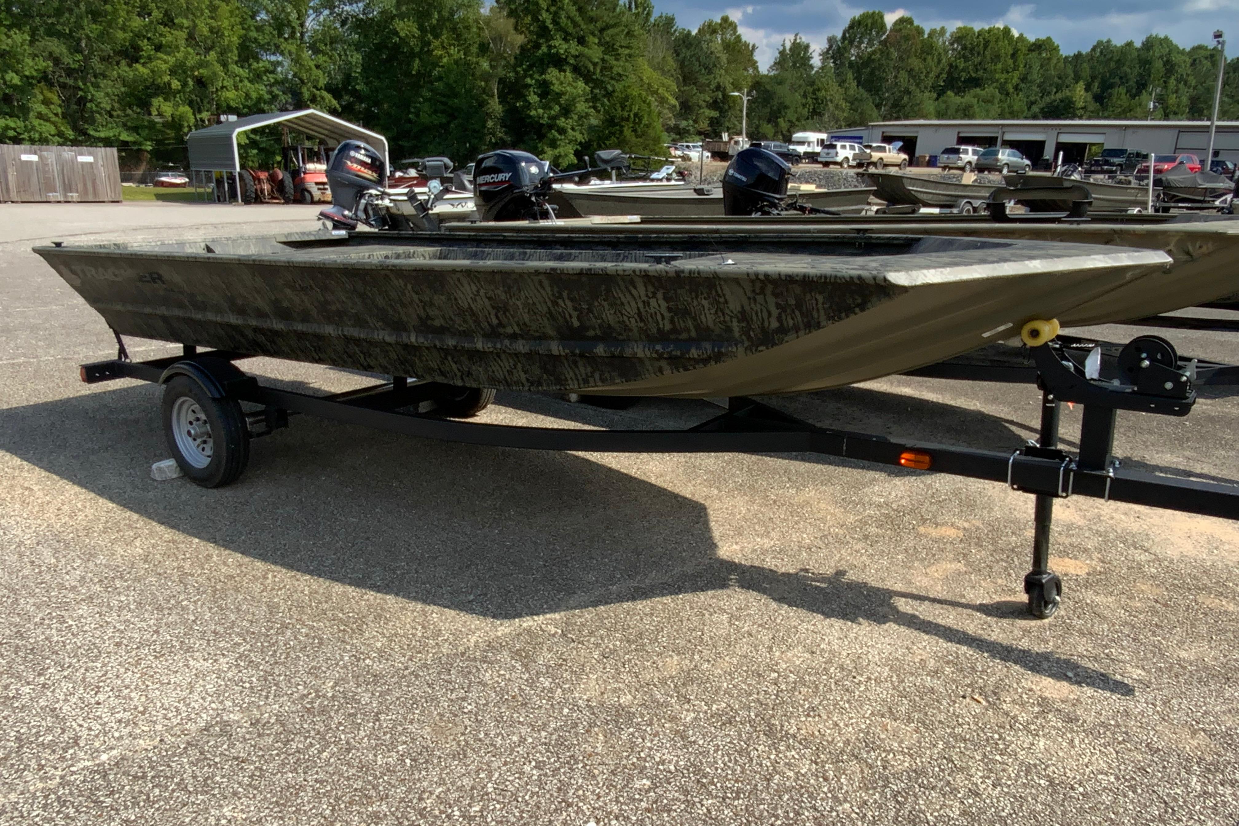 2026 Tracker Grizzly 1648 Utility boat on trailer in outdoor setting.