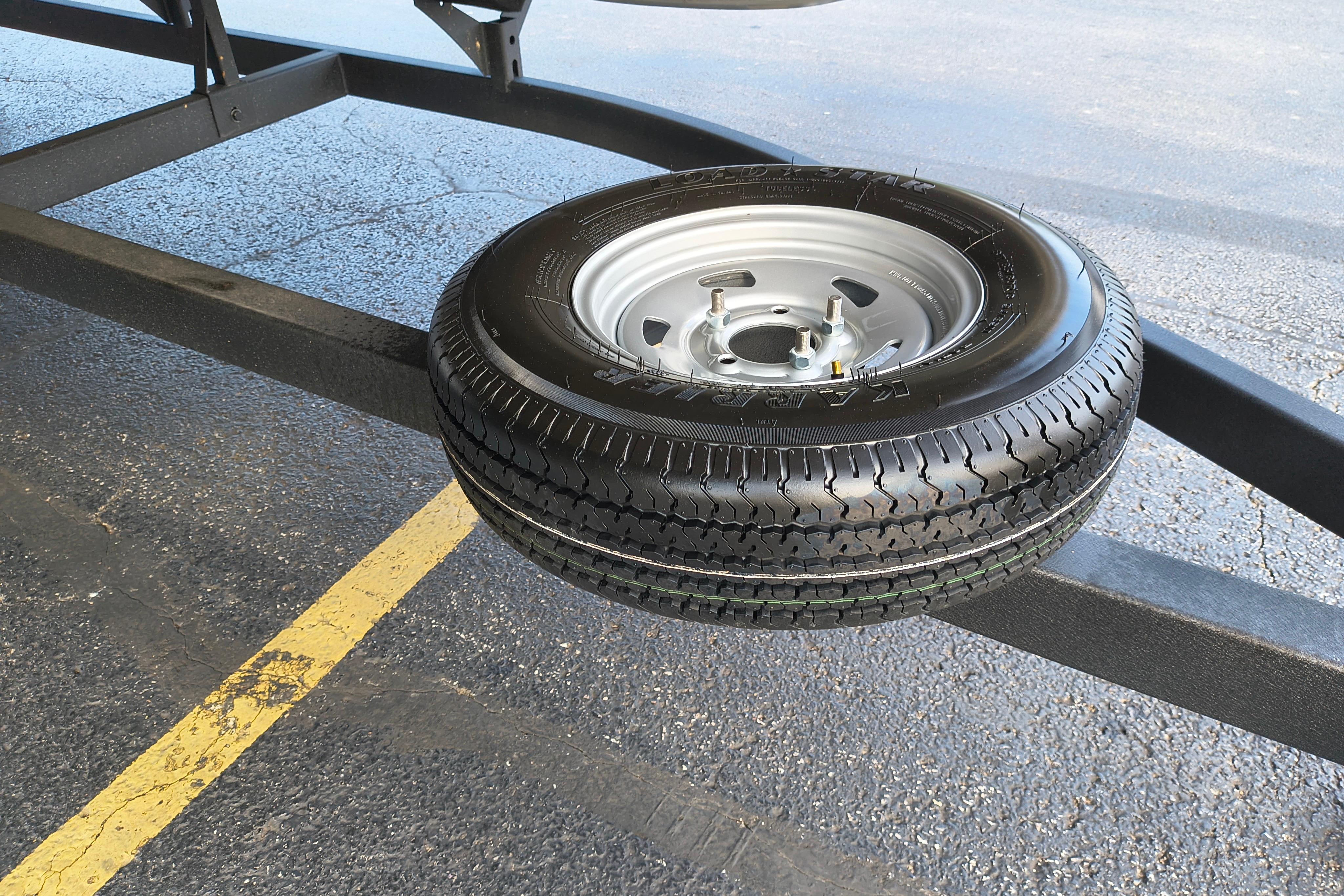 Spare tire mounted on a trailer for a 2026 Sun Tracker Fishin' Barge 22 DLX.
