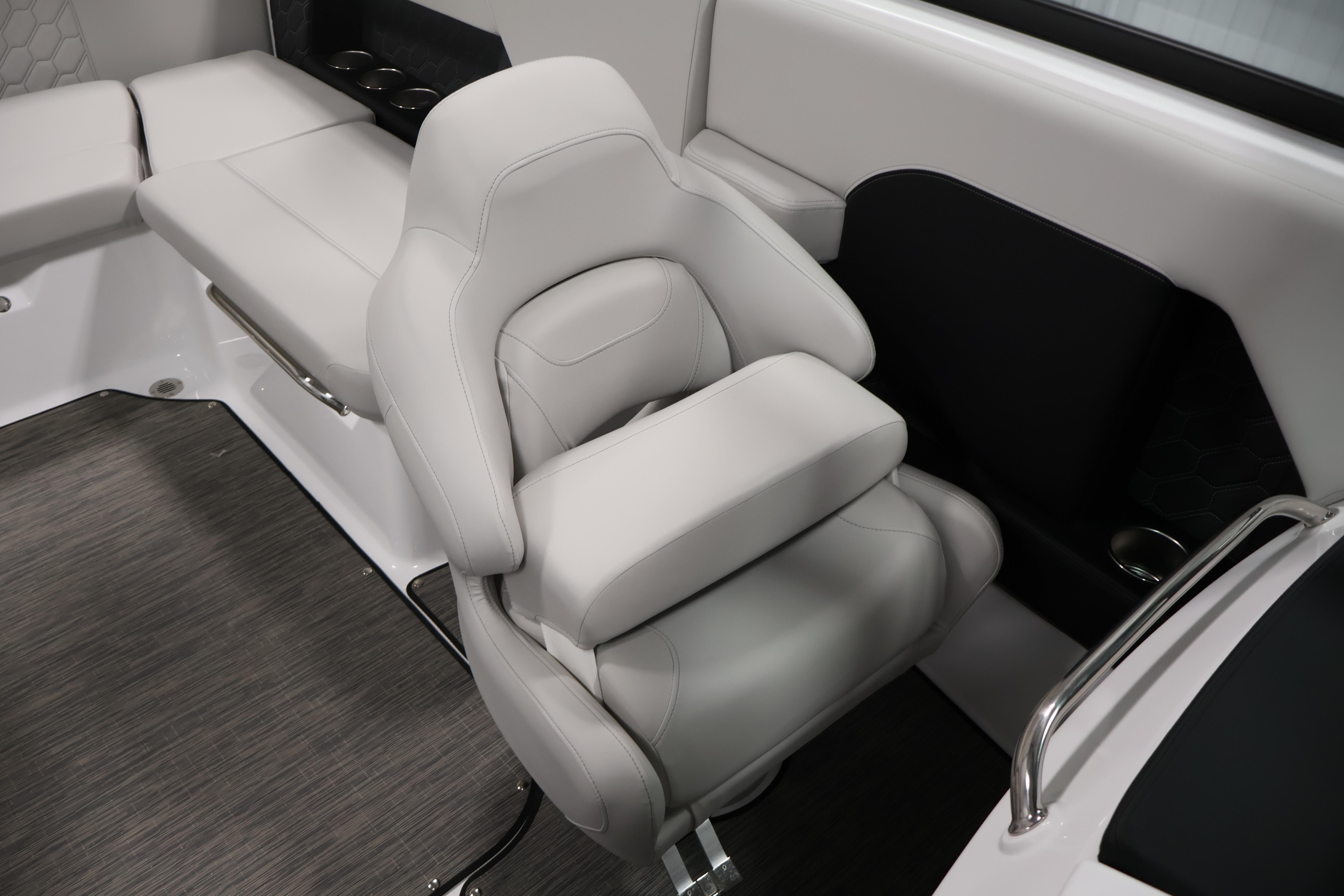 Luxurious seating in the 2026 Four Winns H4 Freedom boat interior, featuring sleek design and comfort.