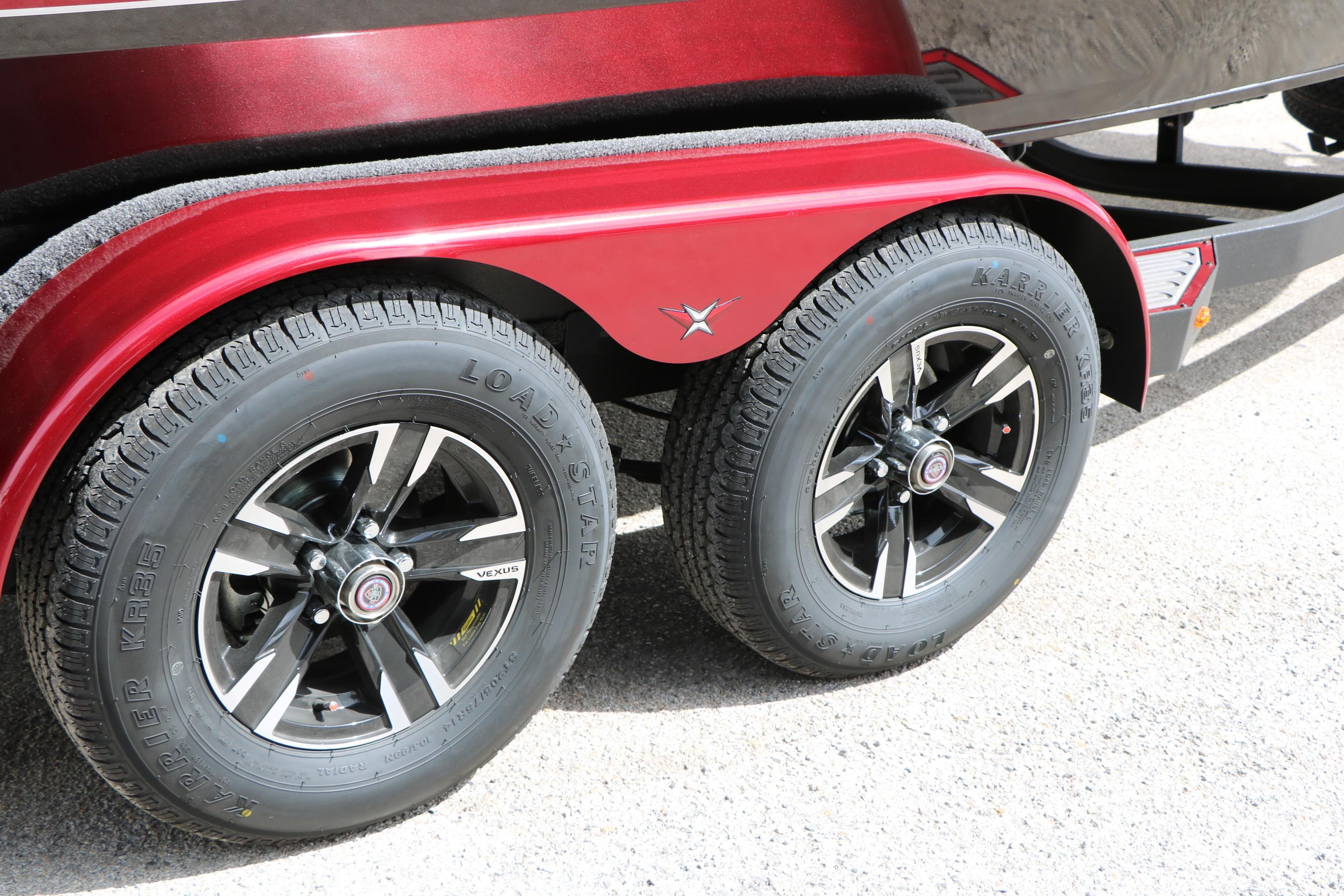 Red Vexus AVX 1985s 2026 trailer with black alloy wheels and Loadstar tires.