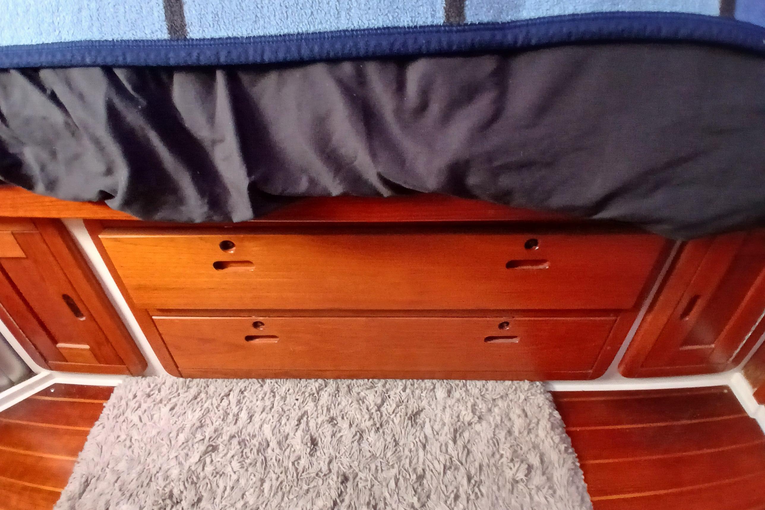 Wooden drawers and bed in a 1995 Catalina 42 MkII yacht interior.