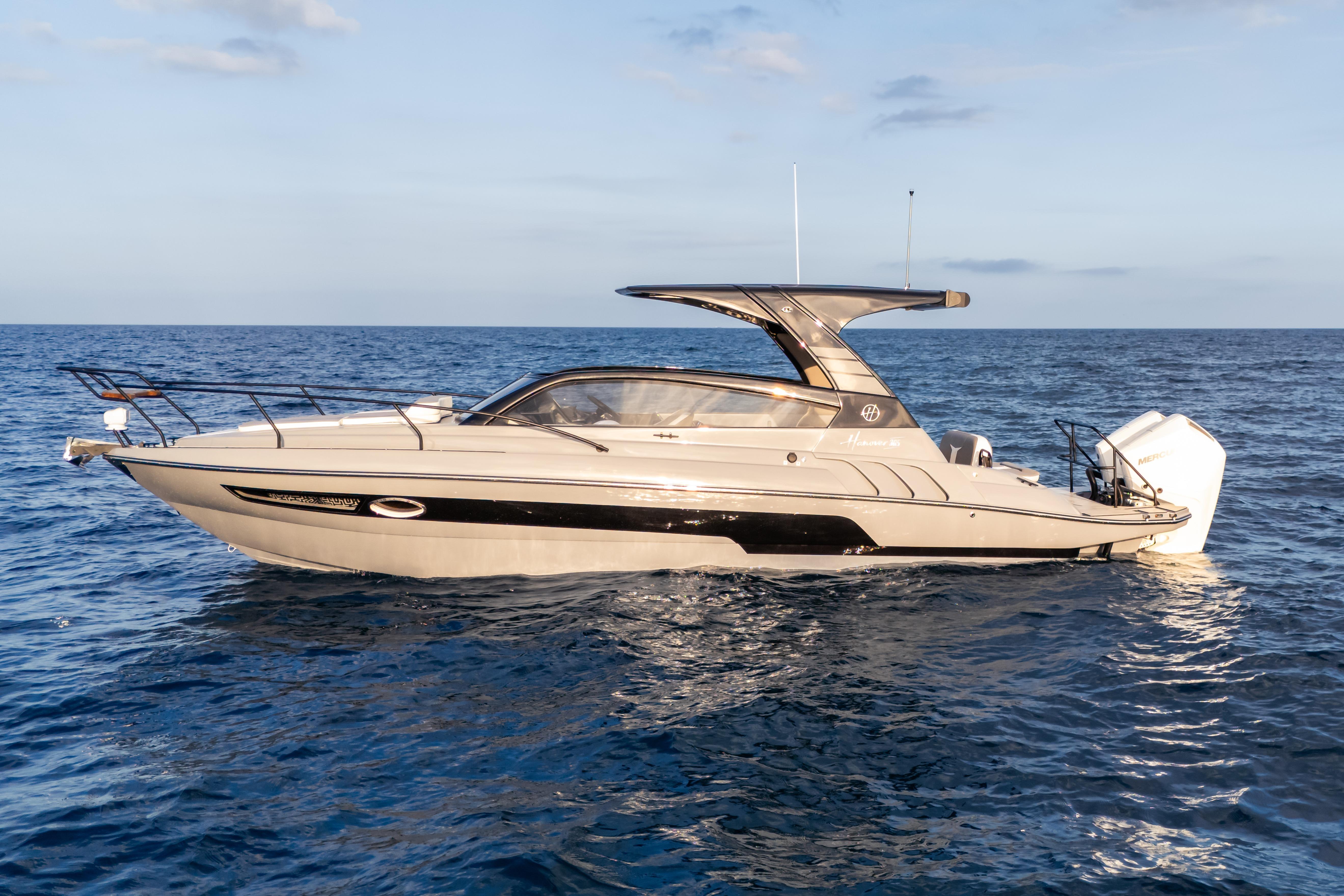 2026 Hanover 305 yacht cruising on open sea under clear sky.