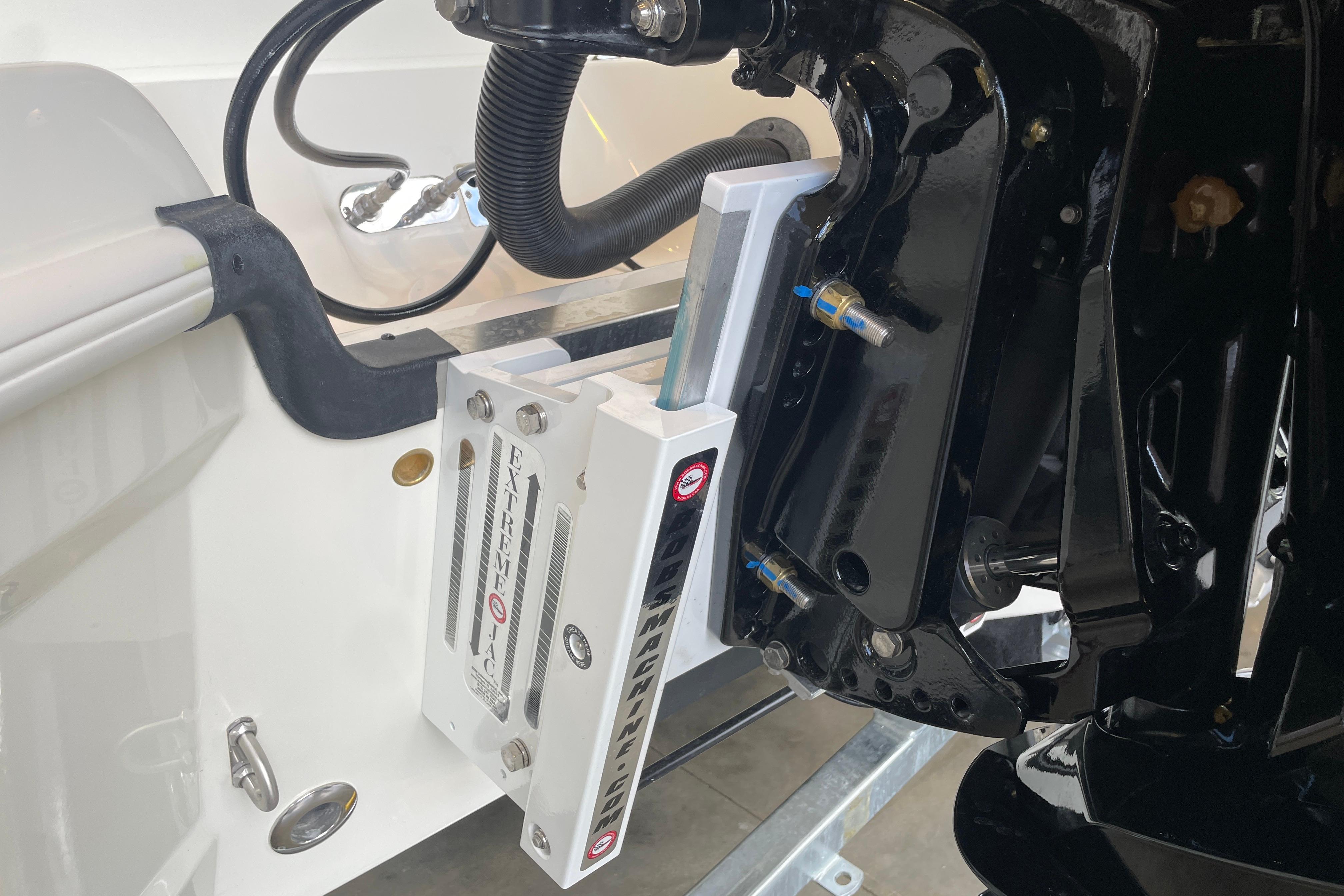 Close-up of 2026 Mako 24 APEX boat engine mount and hydraulic system.