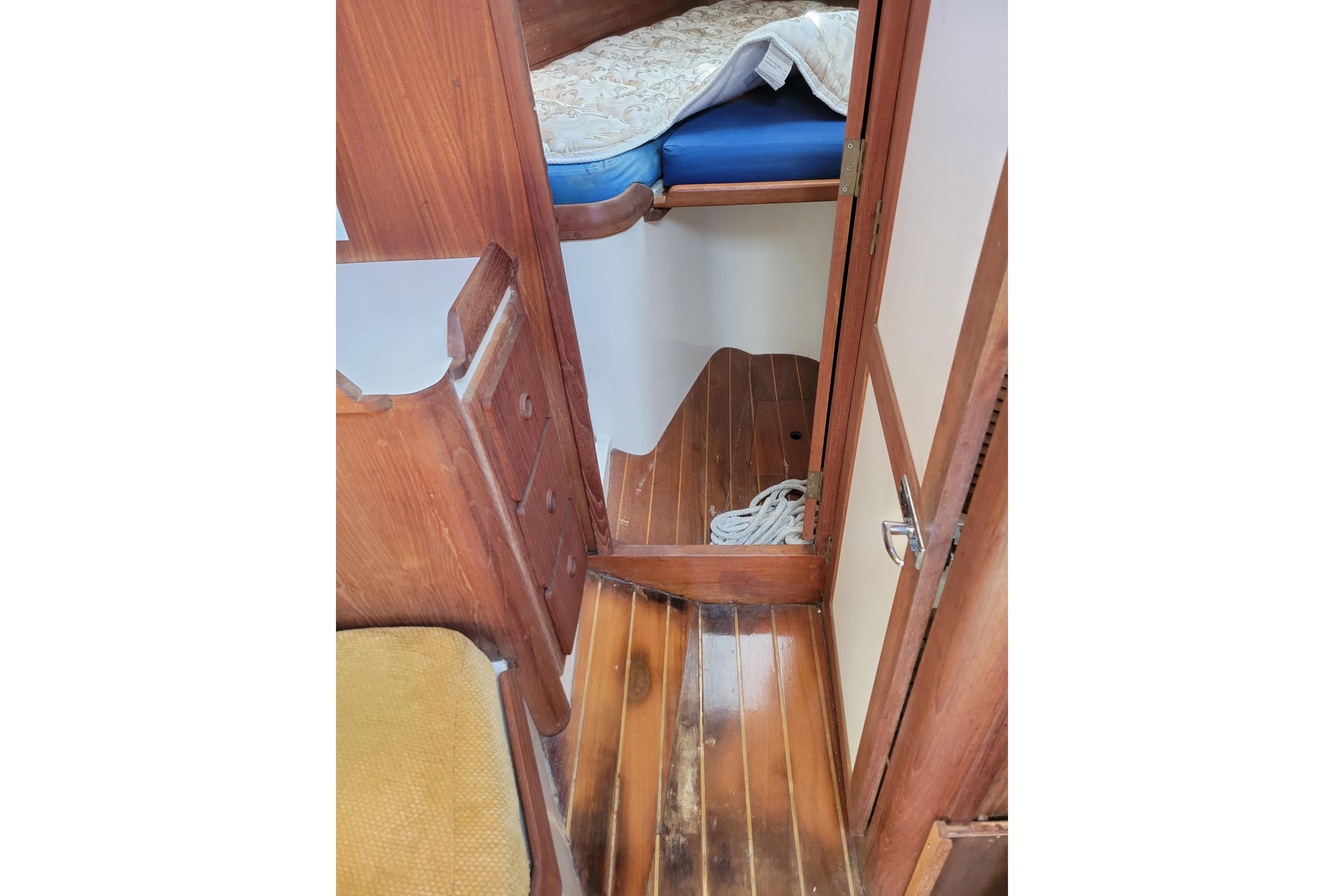 Interior of 1981 Sea Sprite 34 sailboat with wooden flooring and cozy cabin space.