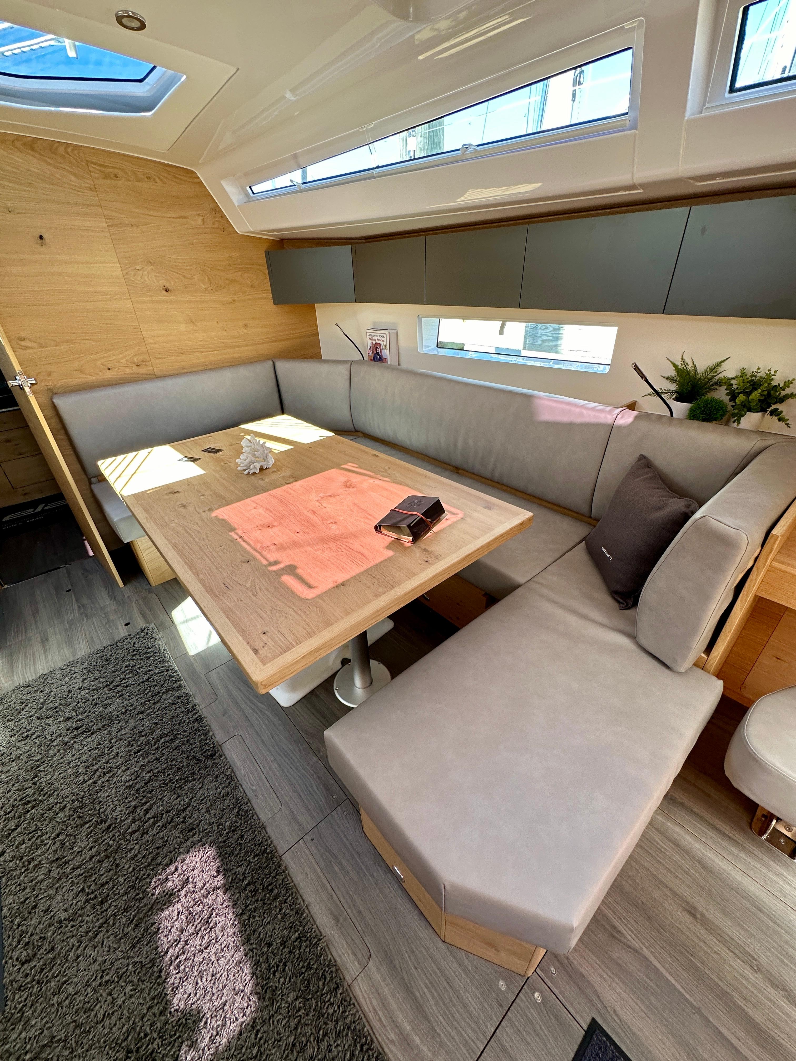 2024 Elan Impression 43 yacht interior with modern seating and natural light.