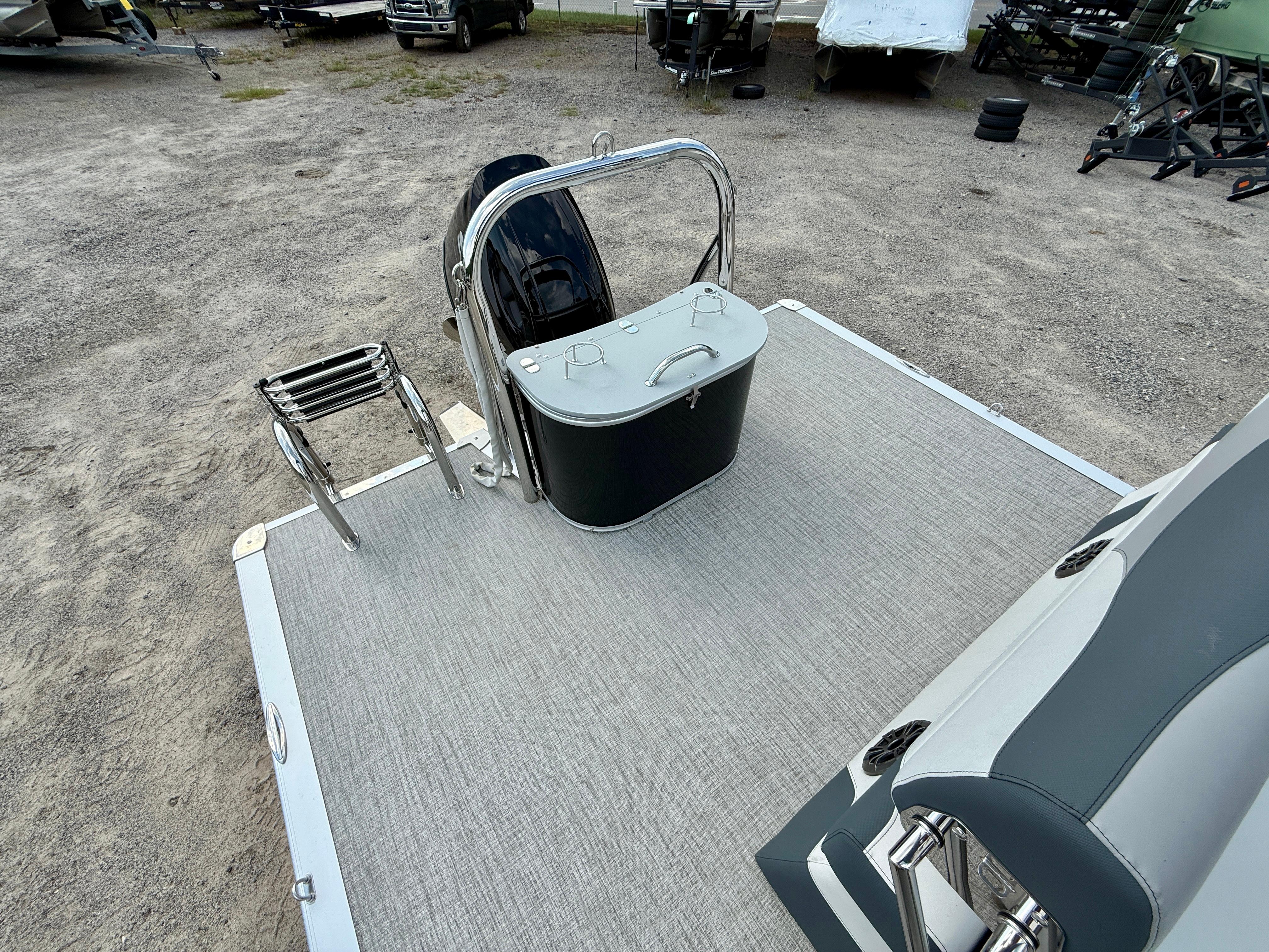 2025 Avalon LSZ Cruise Rear Bench boat deck with ladder and storage compartment.