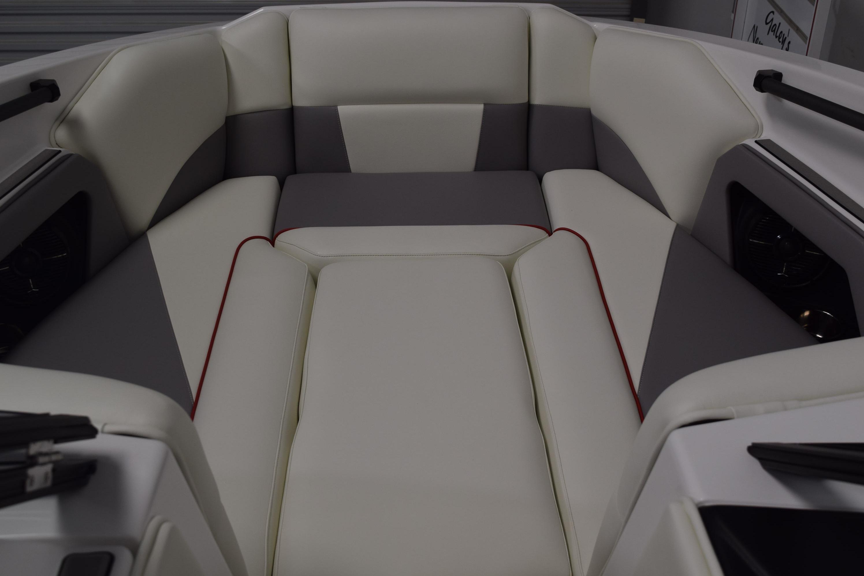 2026 Moomba Craz boat interior with white and gray cushioned seating.