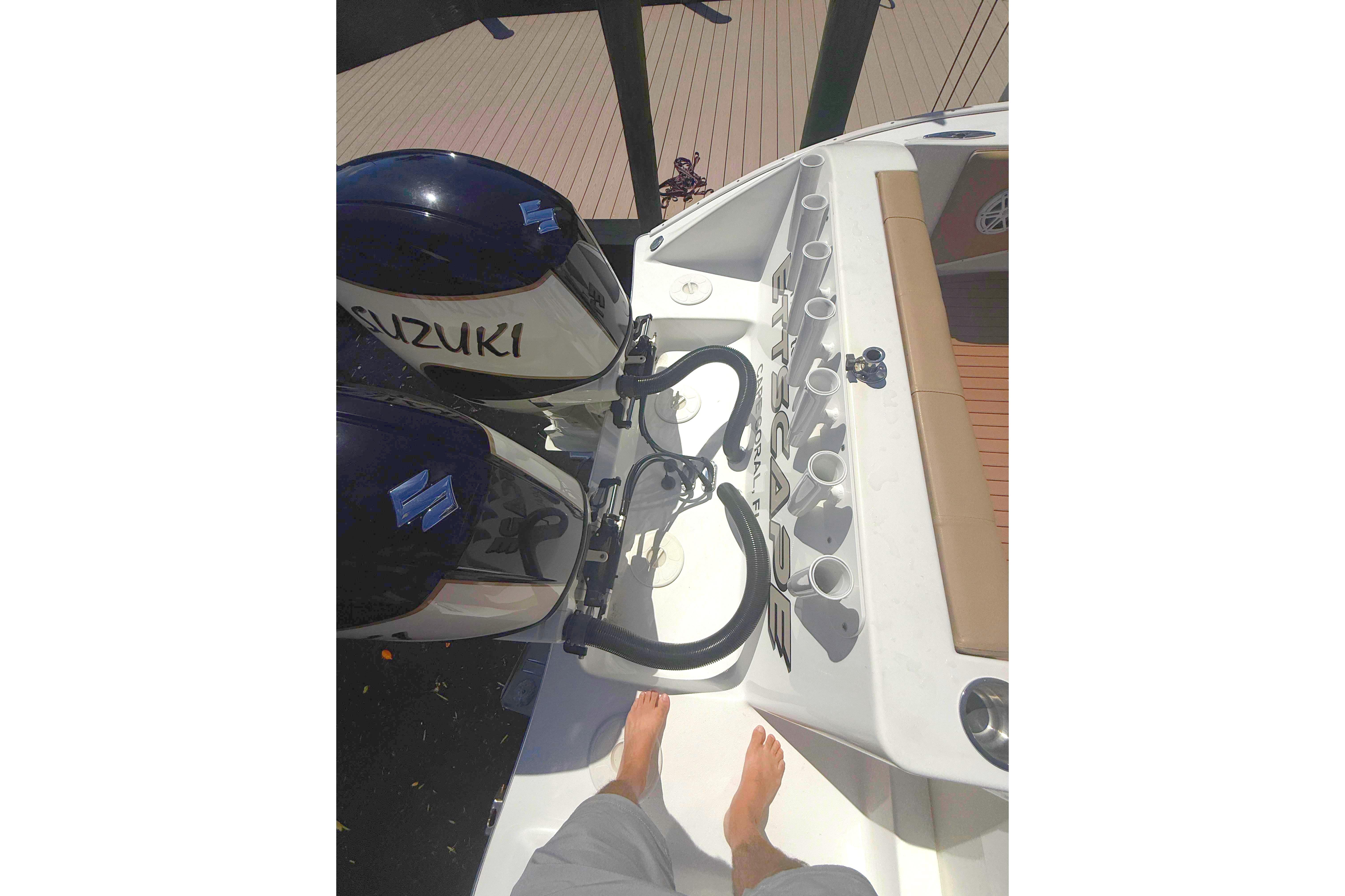 2019 Cape Horn 27XS boat with Suzuki engines and rod holders, viewed from above.