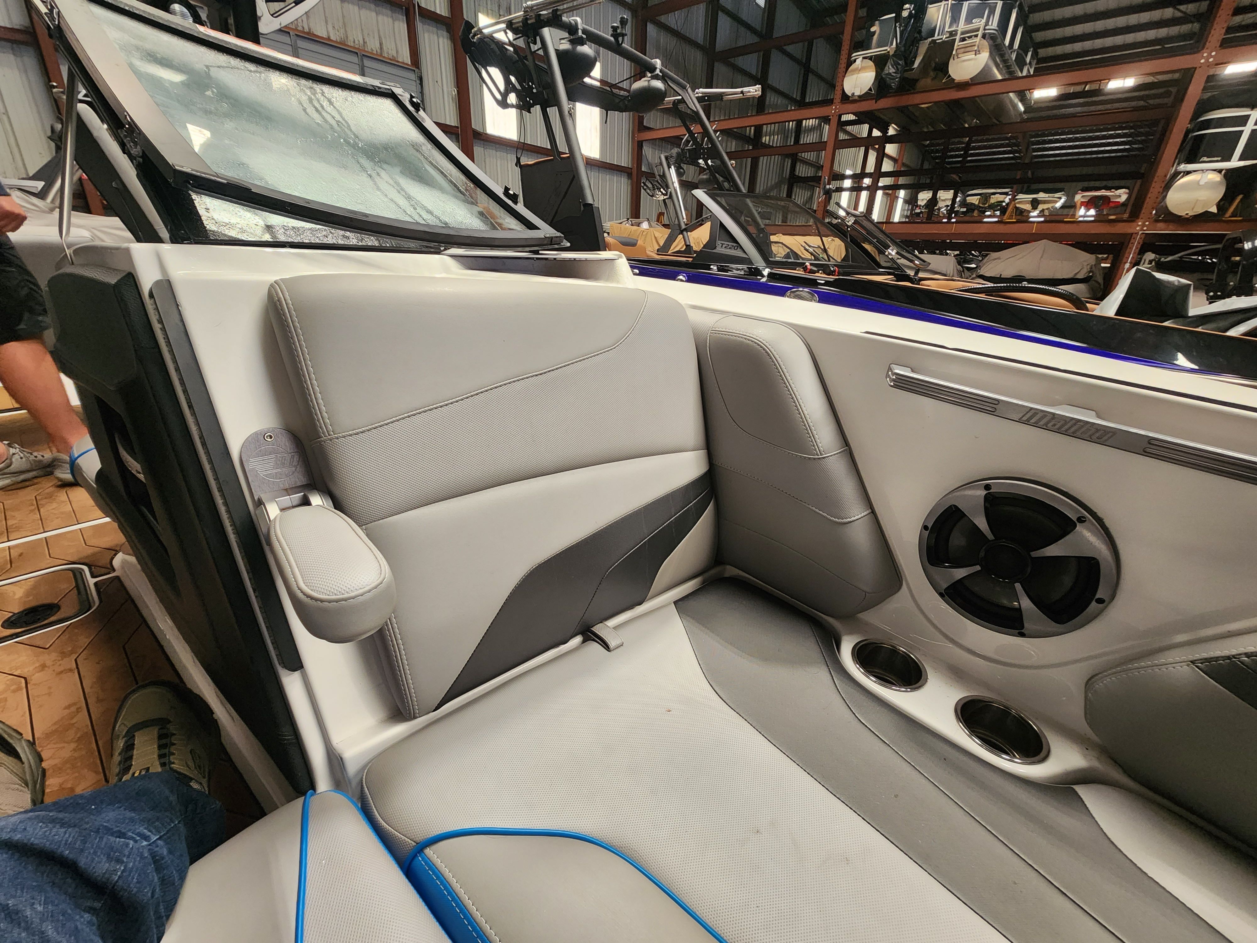 Interior of a 2017 Malibu Wakesetter 24 MXZ boat with gray seating.
