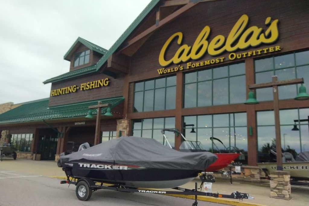 2026 Tracker Pro Guide V-16 WT boat outside Cabela's store.