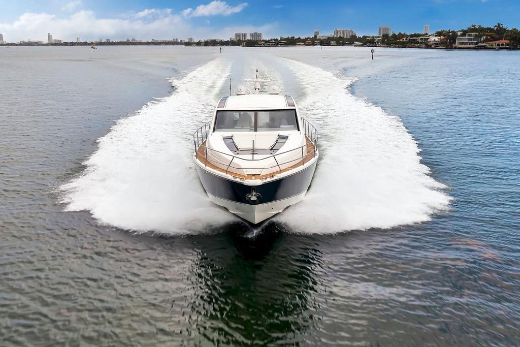 2012 Fairline Targa 58 yacht cruising on open water, leaving a wake behind.