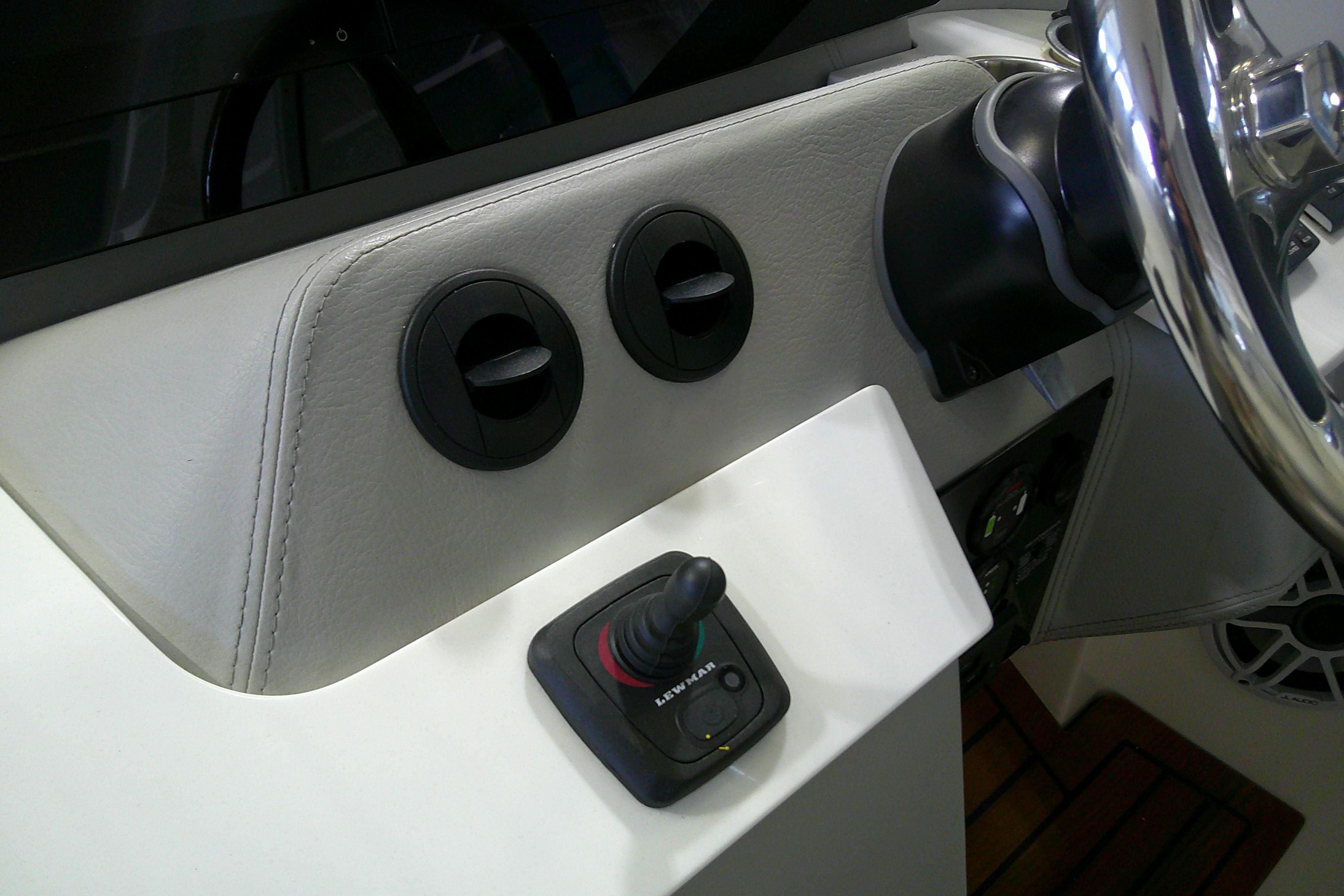 2023 Regal LX36 boat dashboard with steering wheel and control panel.