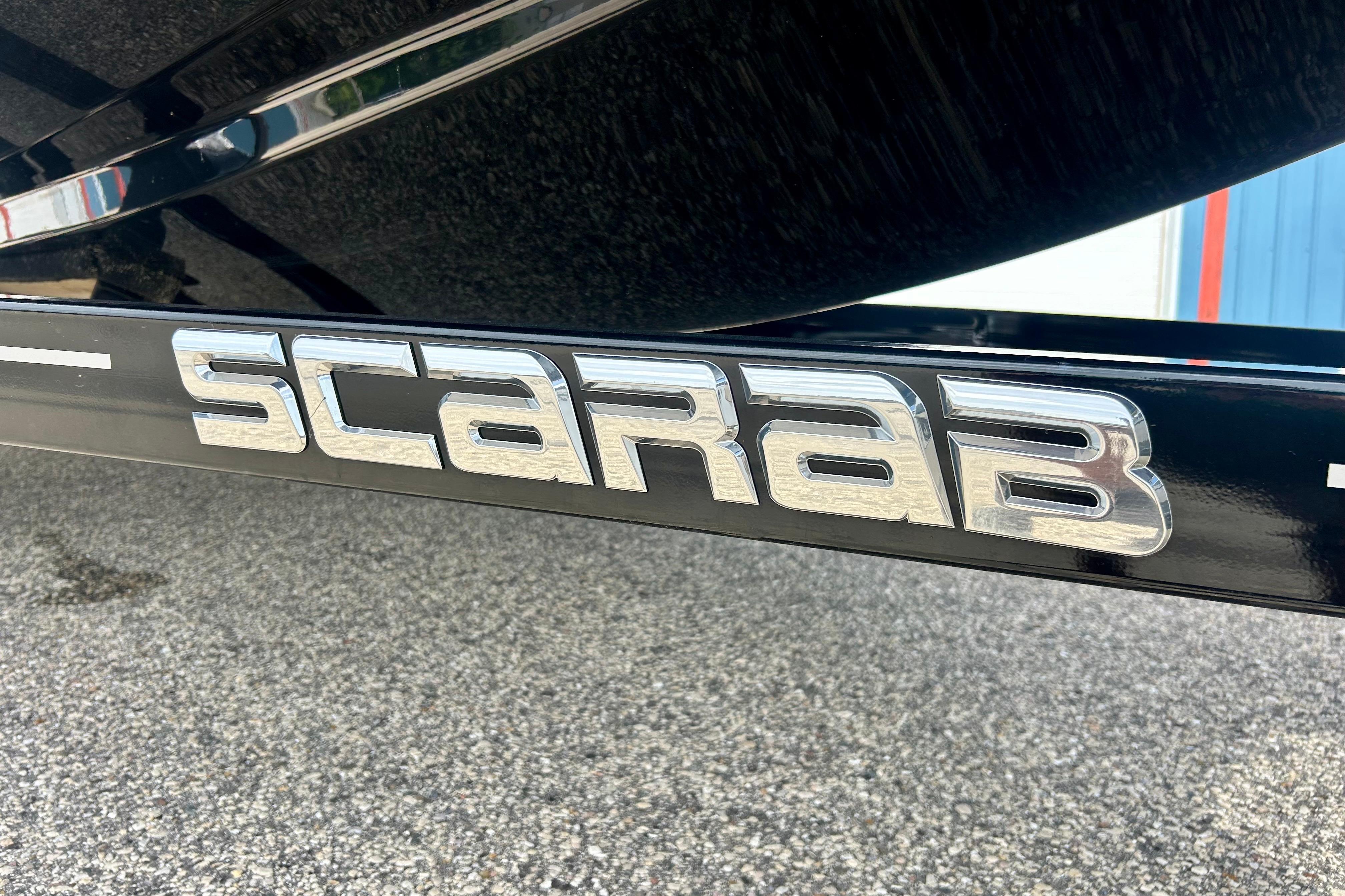 Chrome "Scarab" logo on a 2021 Scarab 195 ID boat trailer.