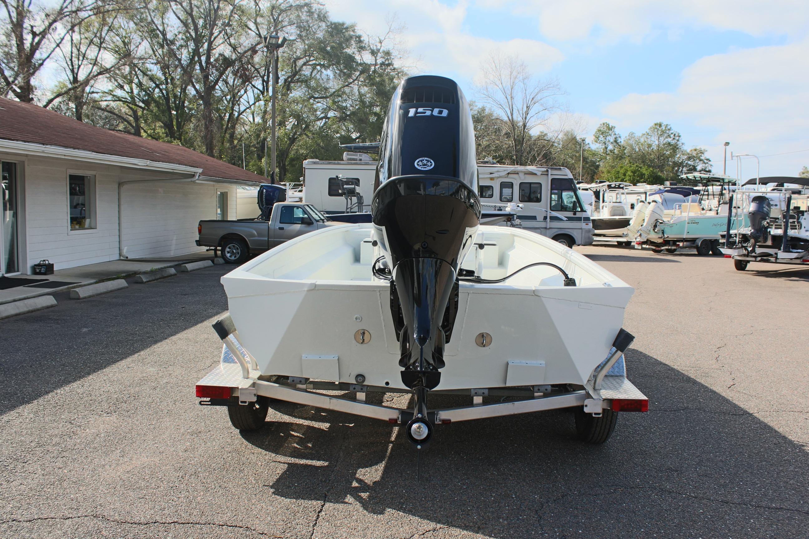 2025 Excel 2172 Stalker CC boat on trailer, rear view with outboard motor.