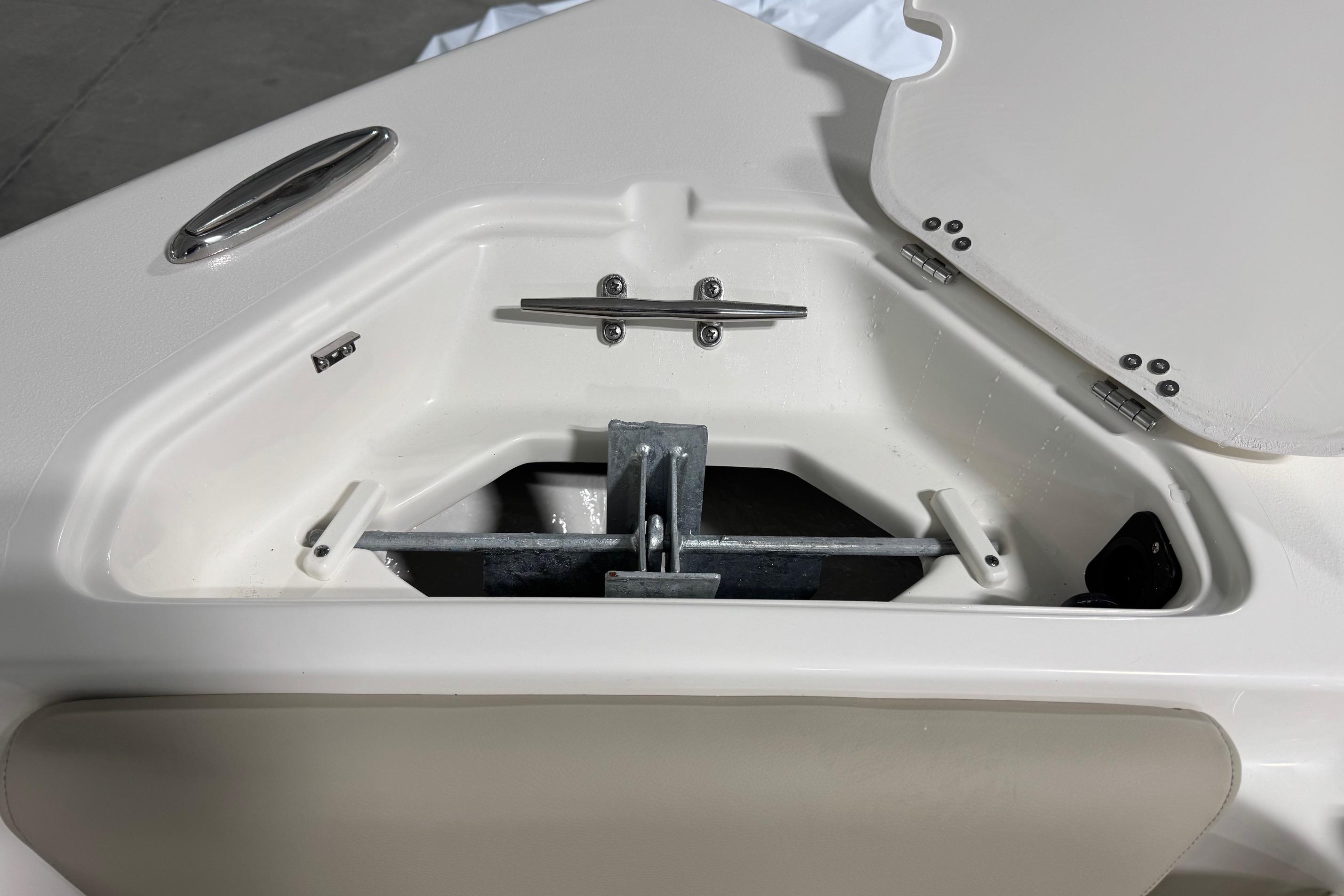 2026 Key West 239 FS boat anchor compartment with open hatch.