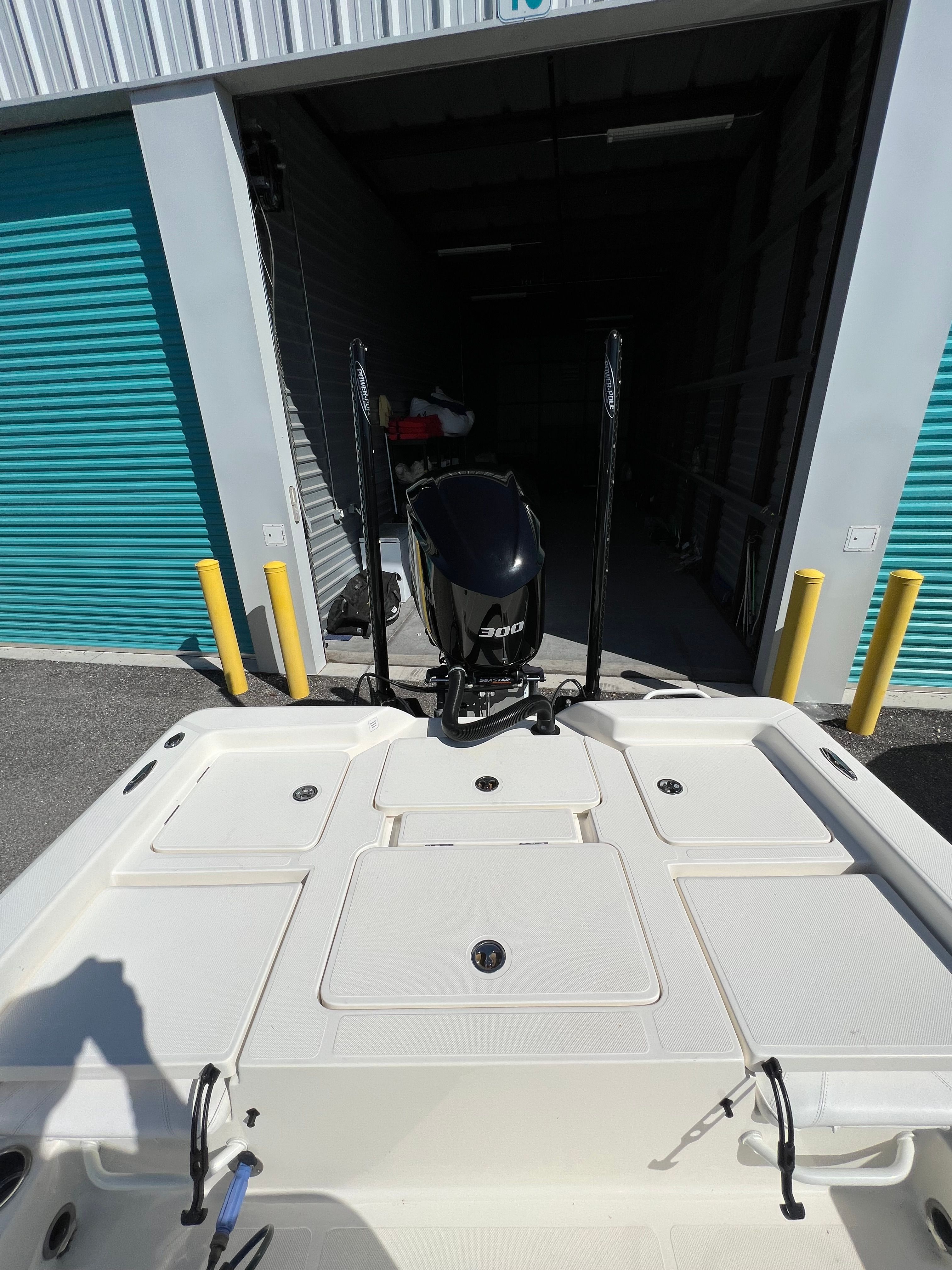The image shows the stern of a 2020 Skeeter SX240 boat in a storage facility.
