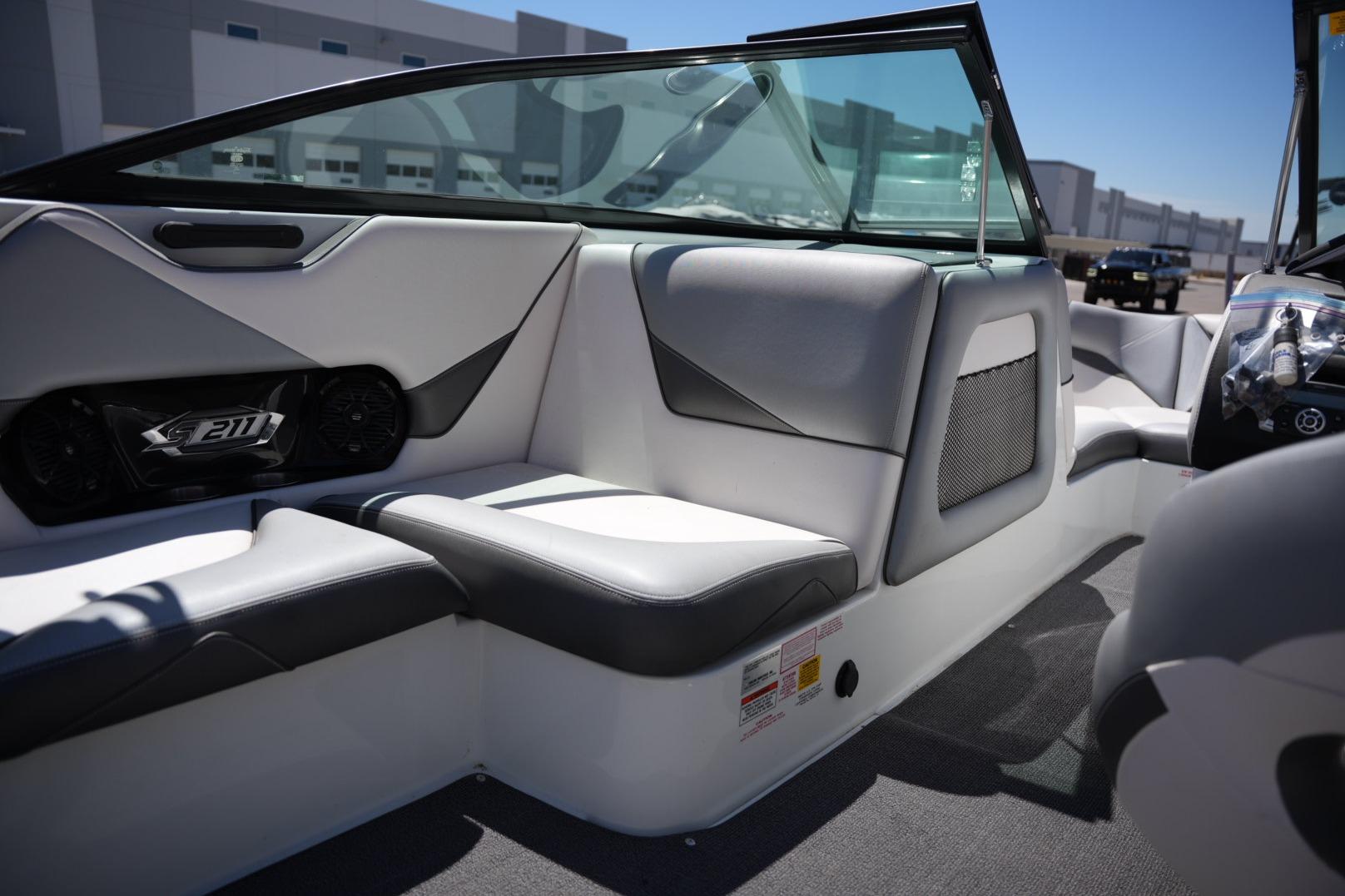 Interior of a 2016 Supreme S211 boat, featuring sleek seating and modern design.