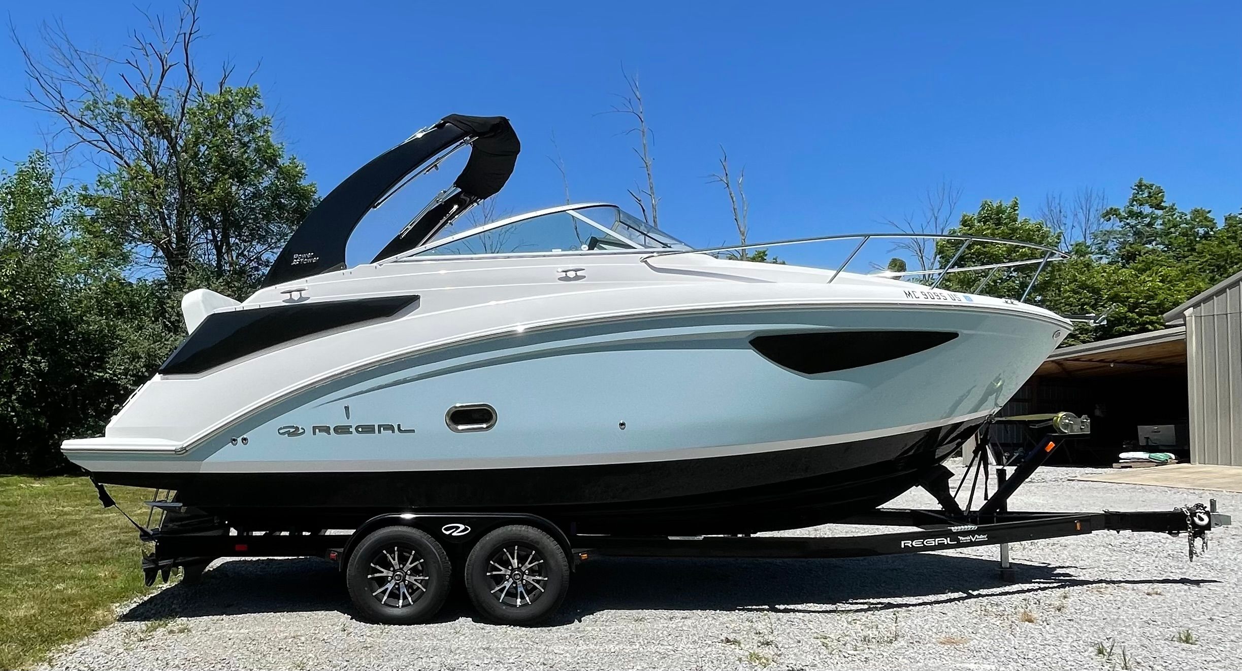 2022 Regal 26 Express boat on trailer outdoors.