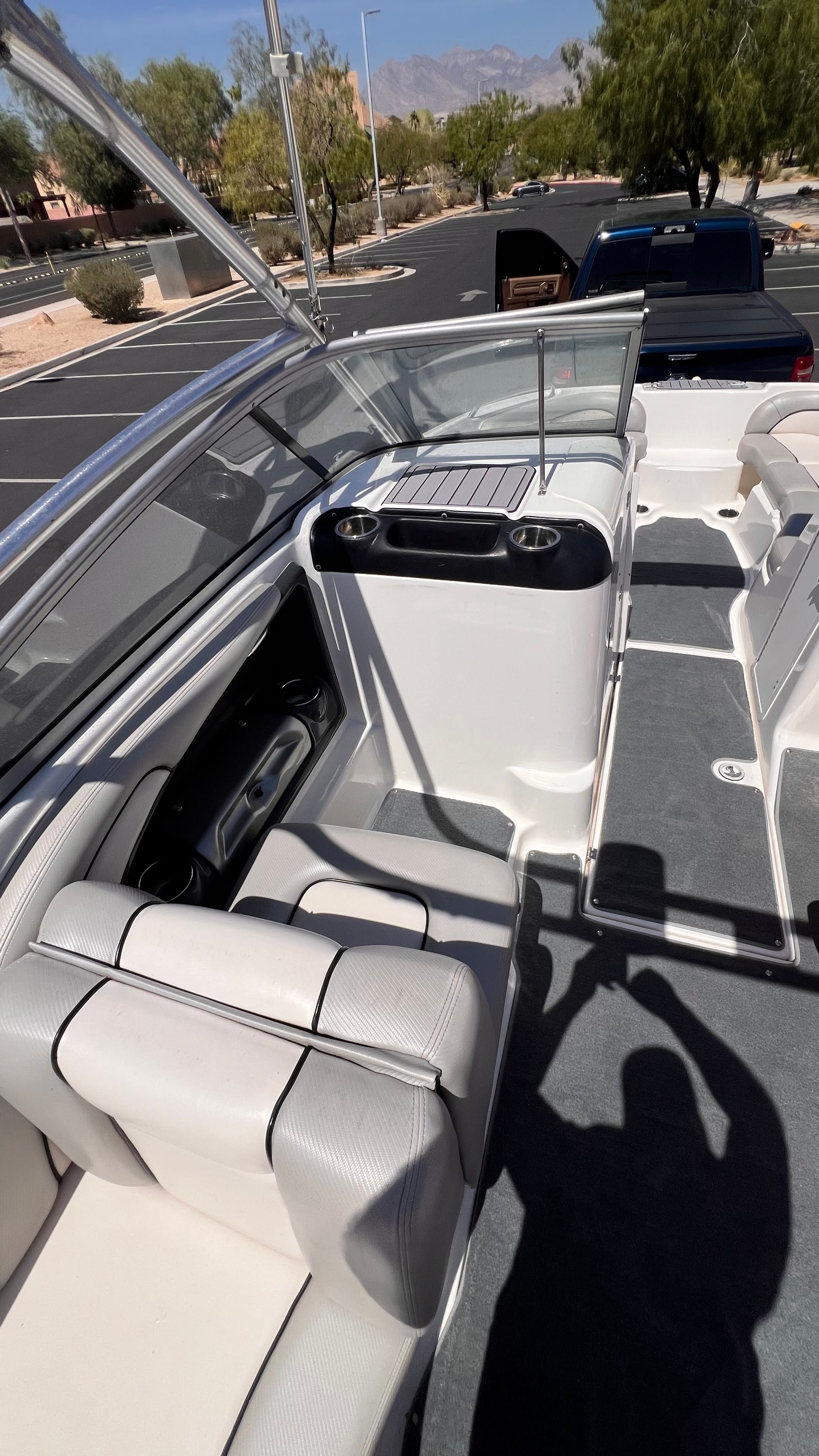 Interior of a 2011 Yamaha AR240 HO boat, parked in a lot.