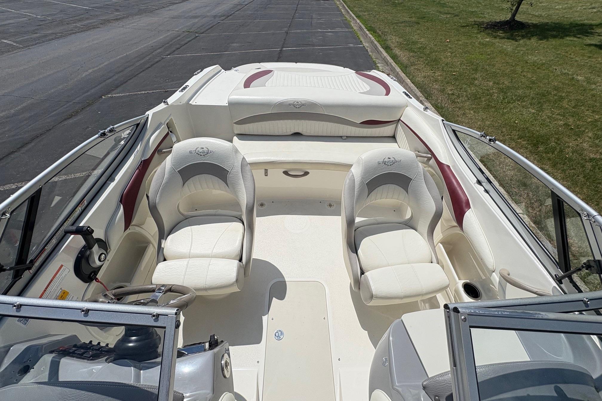 2013 Stingray 198 LX boat interior with white seating and steering wheel.
