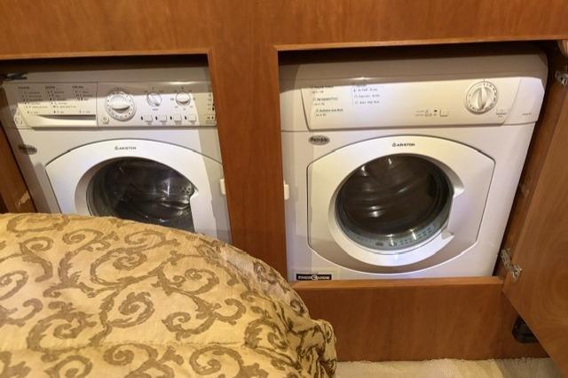 Built-in washer and dryer in a 2007 Navigator 5100 RV interior.
