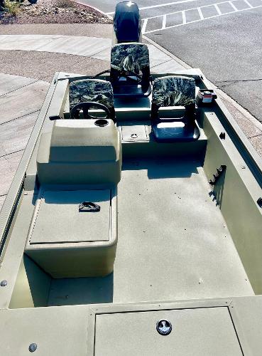 2024 Tracker Grizzly 1754 SC boat with camo seats and steering console.