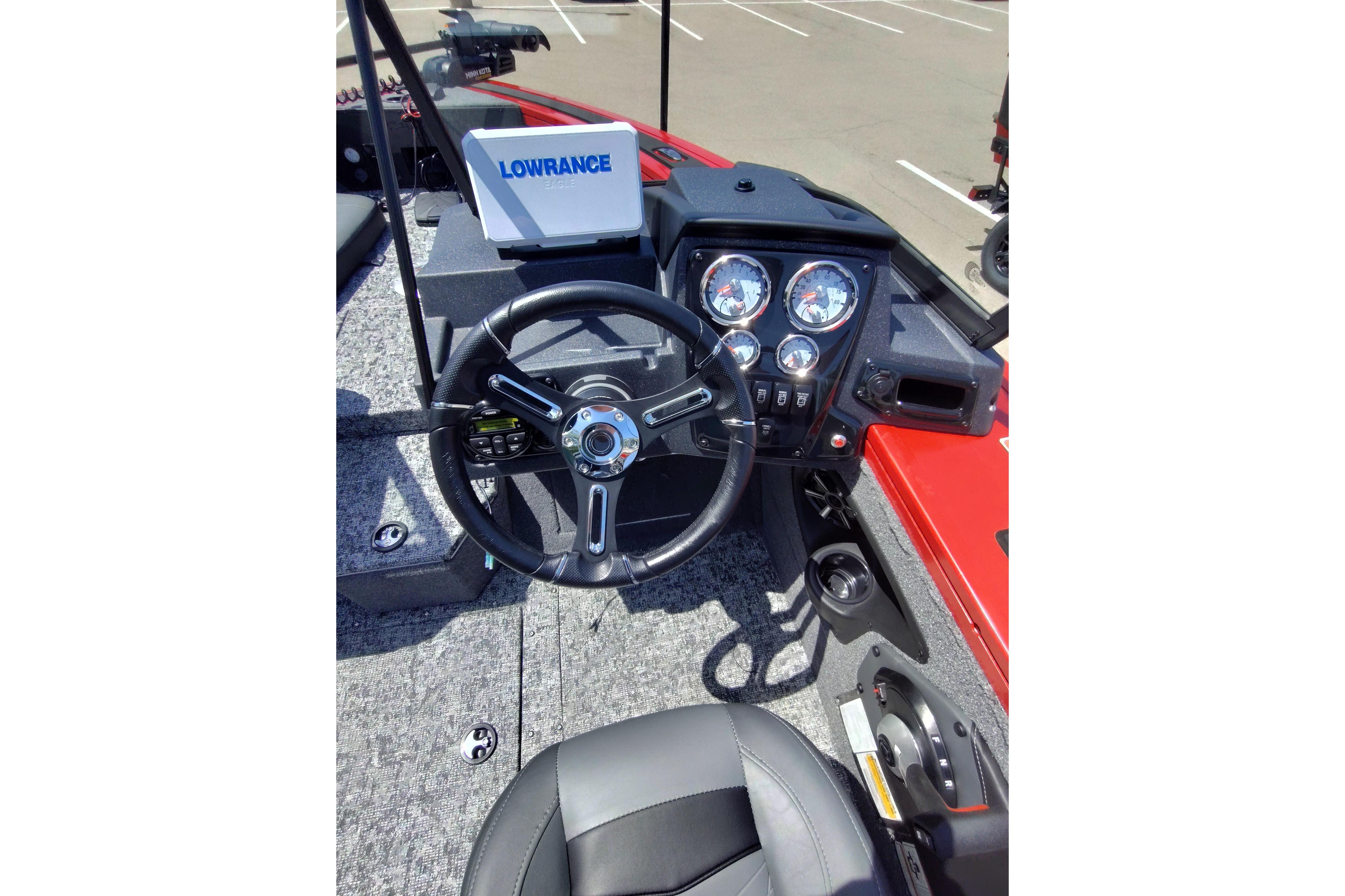 2026 Tracker Targa V-18 Combo boat dashboard with steering wheel and gauges.