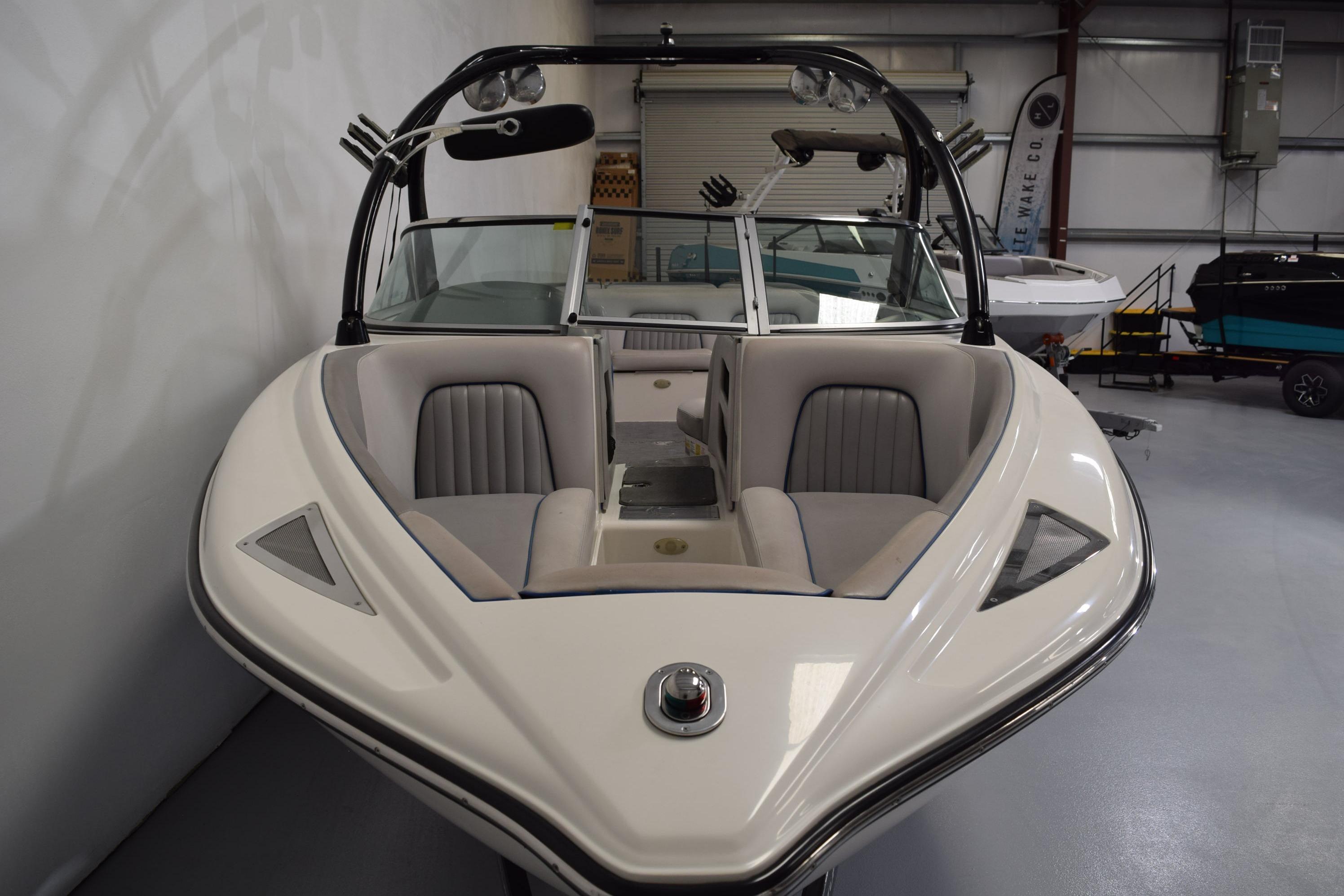 2007 Centurion SV 240 boat in showroom, featuring sleek design and comfortable seating.