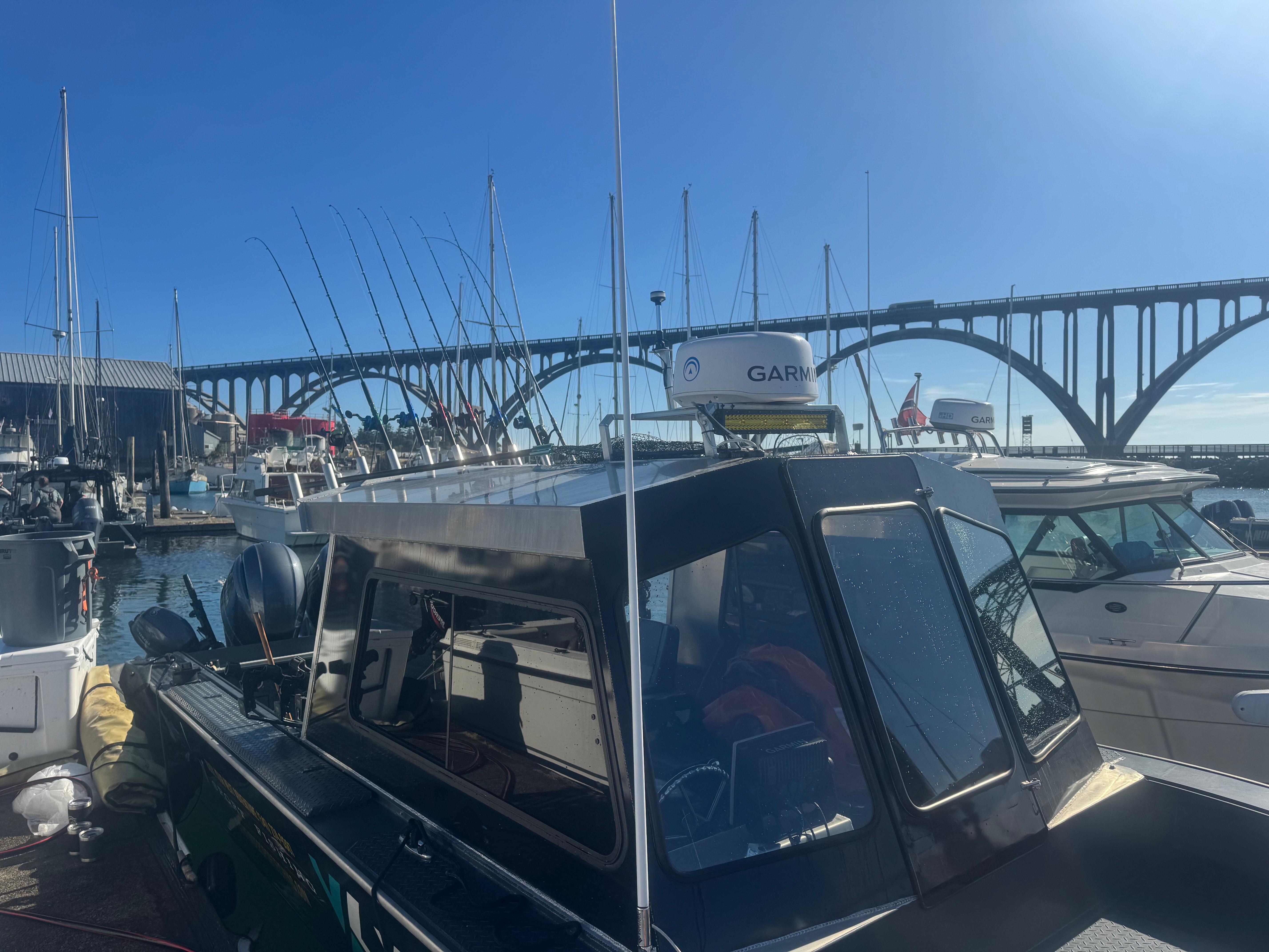 Custom Umpqua Marina 26 Bay Series boat docked at marina, 2022 model.