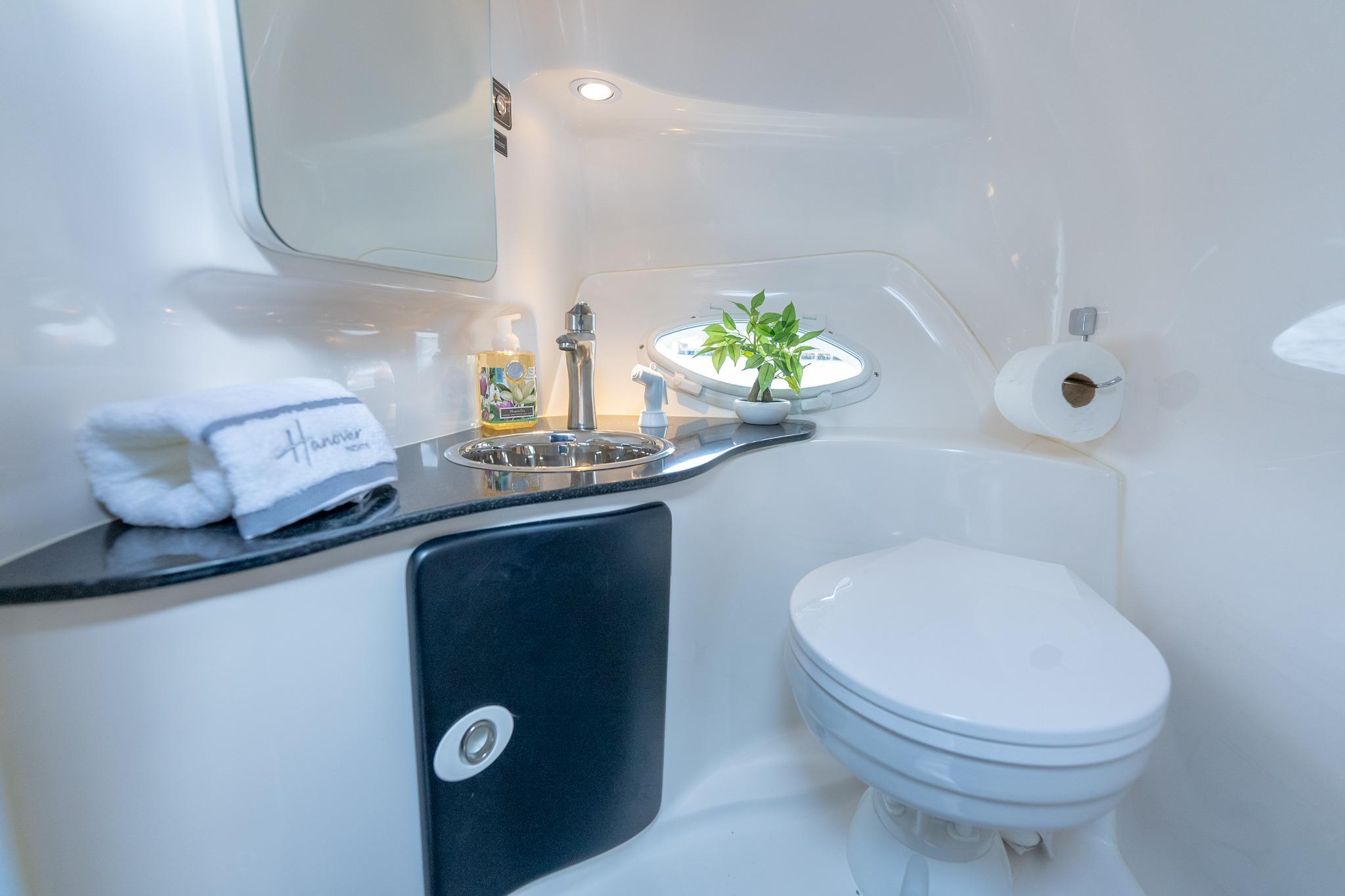 Modern bathroom in Hanover 305, 2027 model, featuring sleek design and compact amenities.