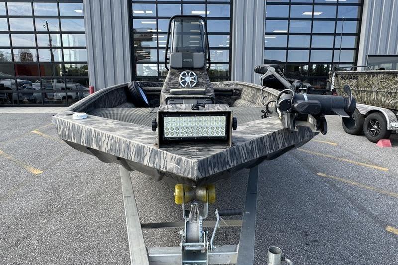 2023 Havoc 1756 MRST boat with camouflage design, equipped with LED light bar and trolling motor.