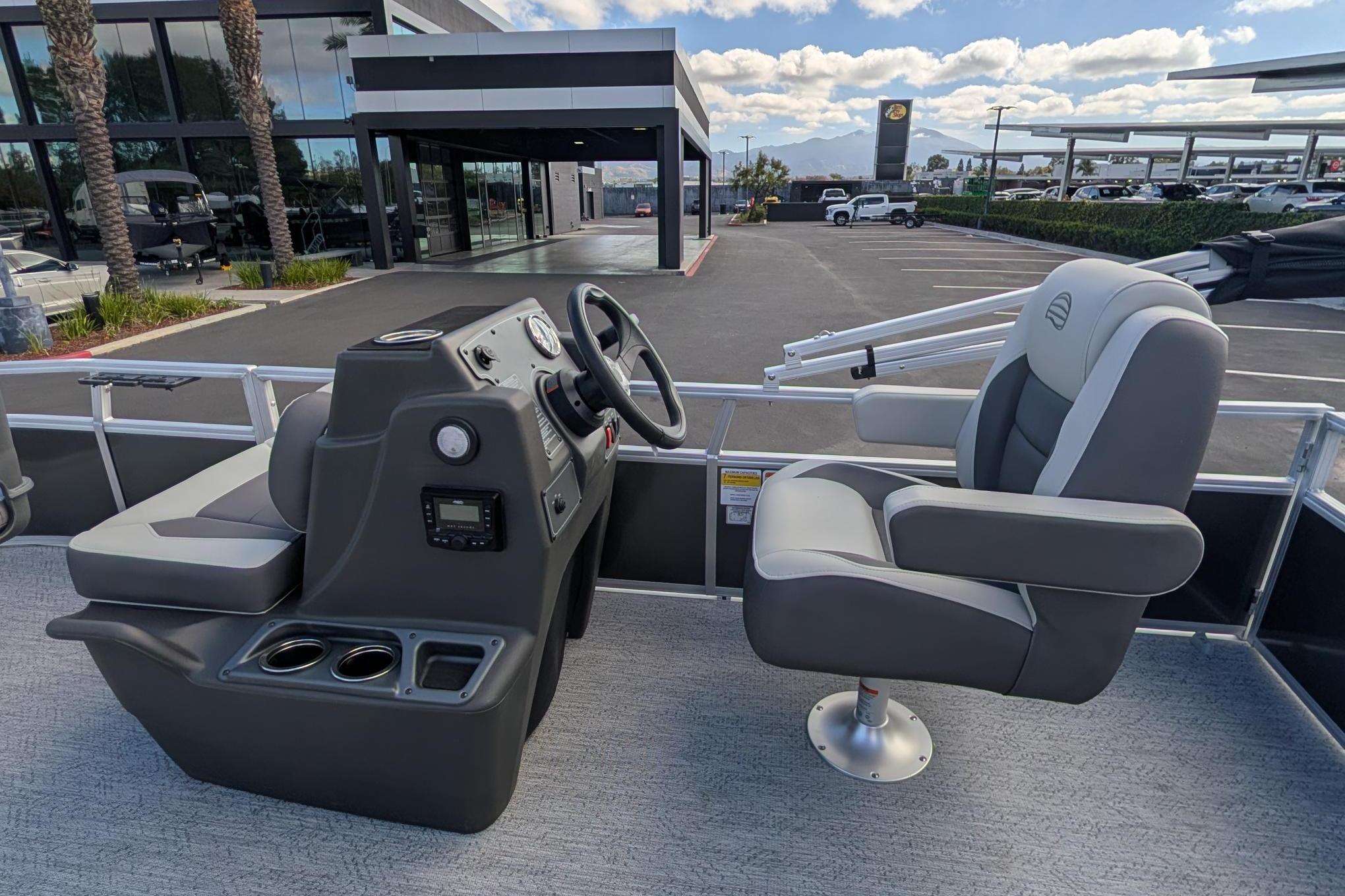2026 Sun Tracker Bass Buggy 16 XL Select boat interior with steering console and seating.