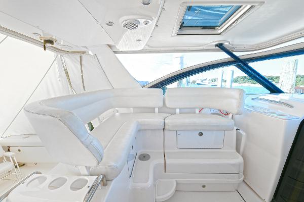 2008 Tiara Yachts 4200 Open interior with white seating and skylight.