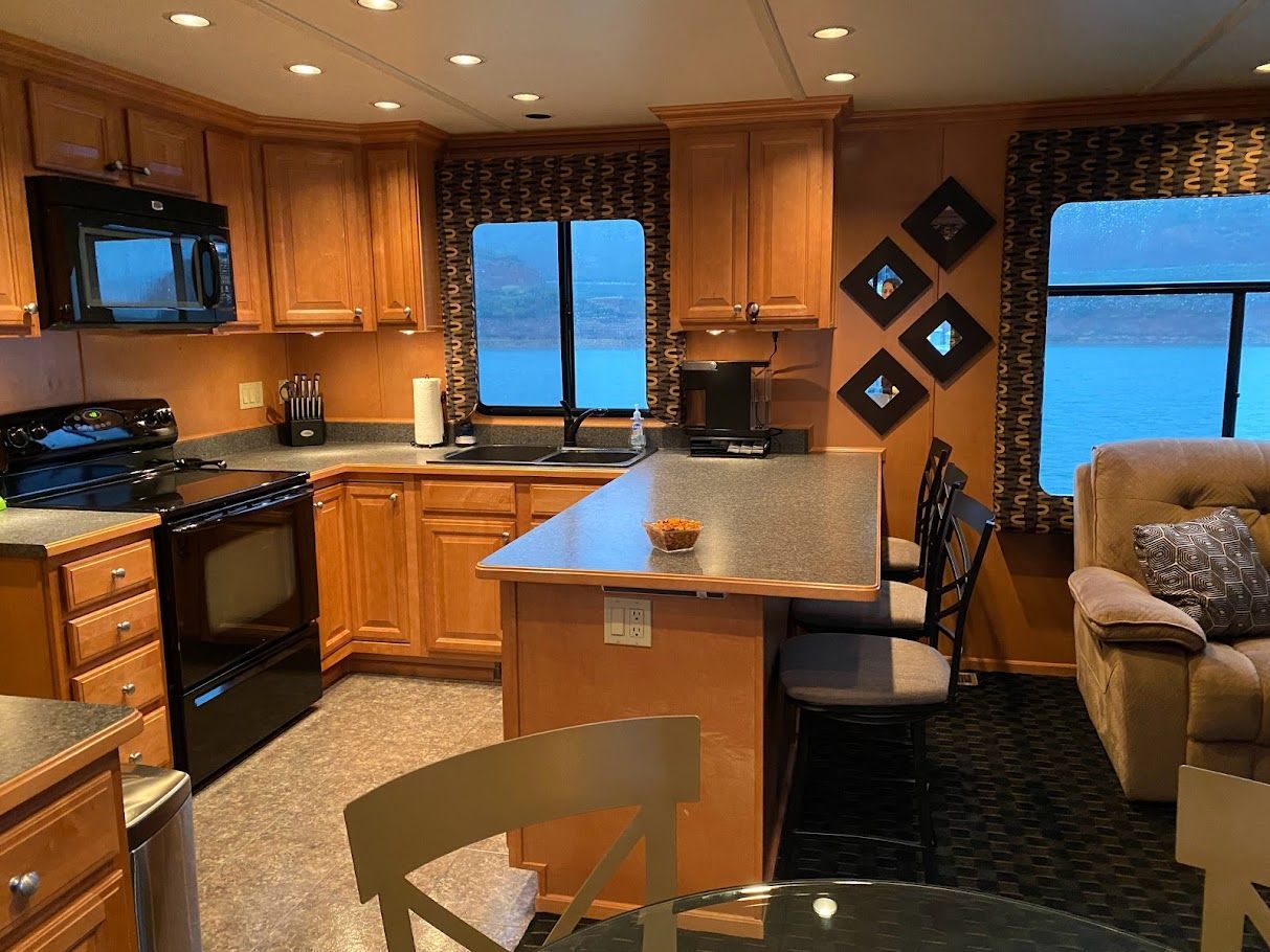 Interior of a 2006 Summersun Houseboats 16x68 with kitchen and living area.