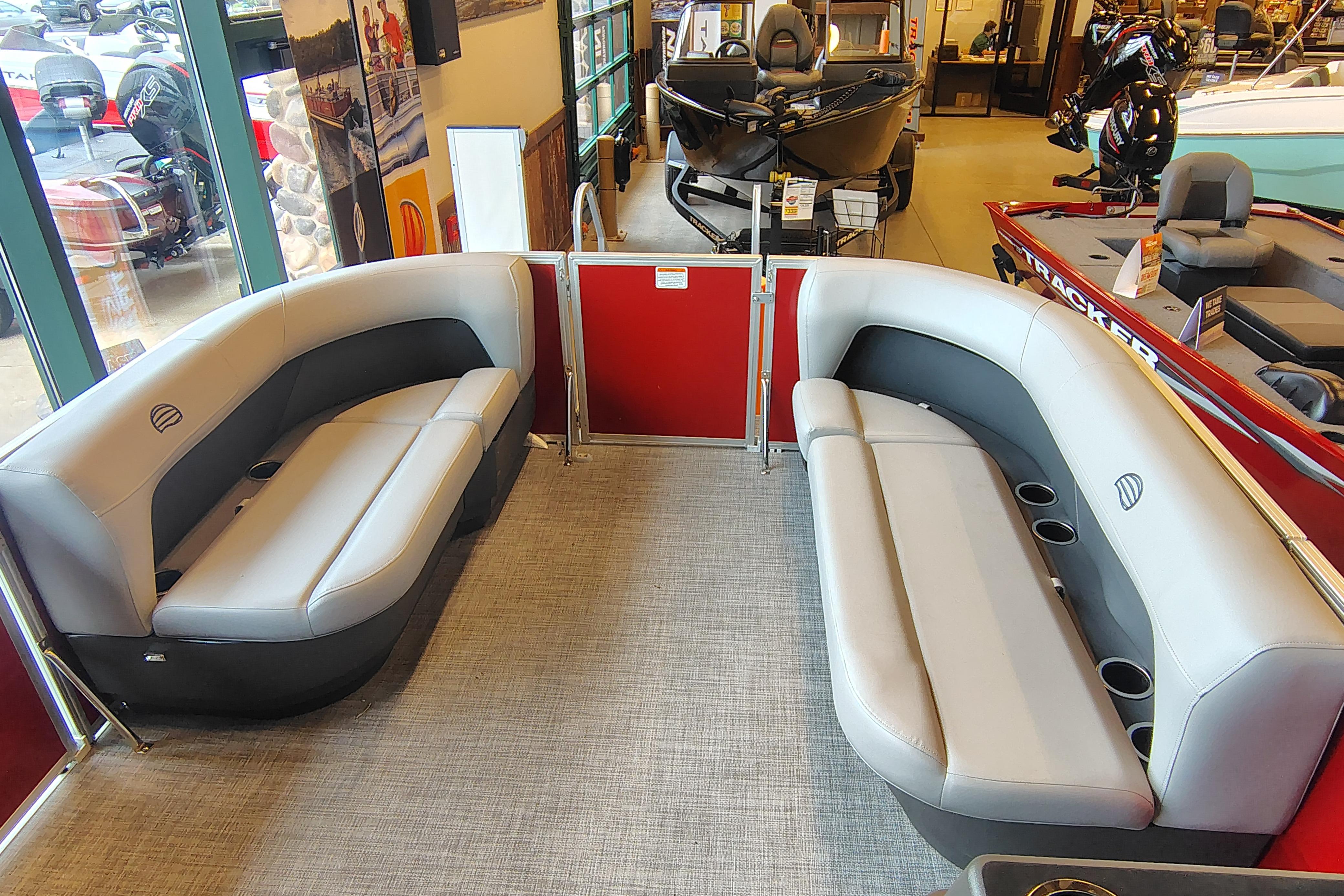 2026 Sun Tracker Party Barge 16 DLX interior with spacious seating and cup holders.